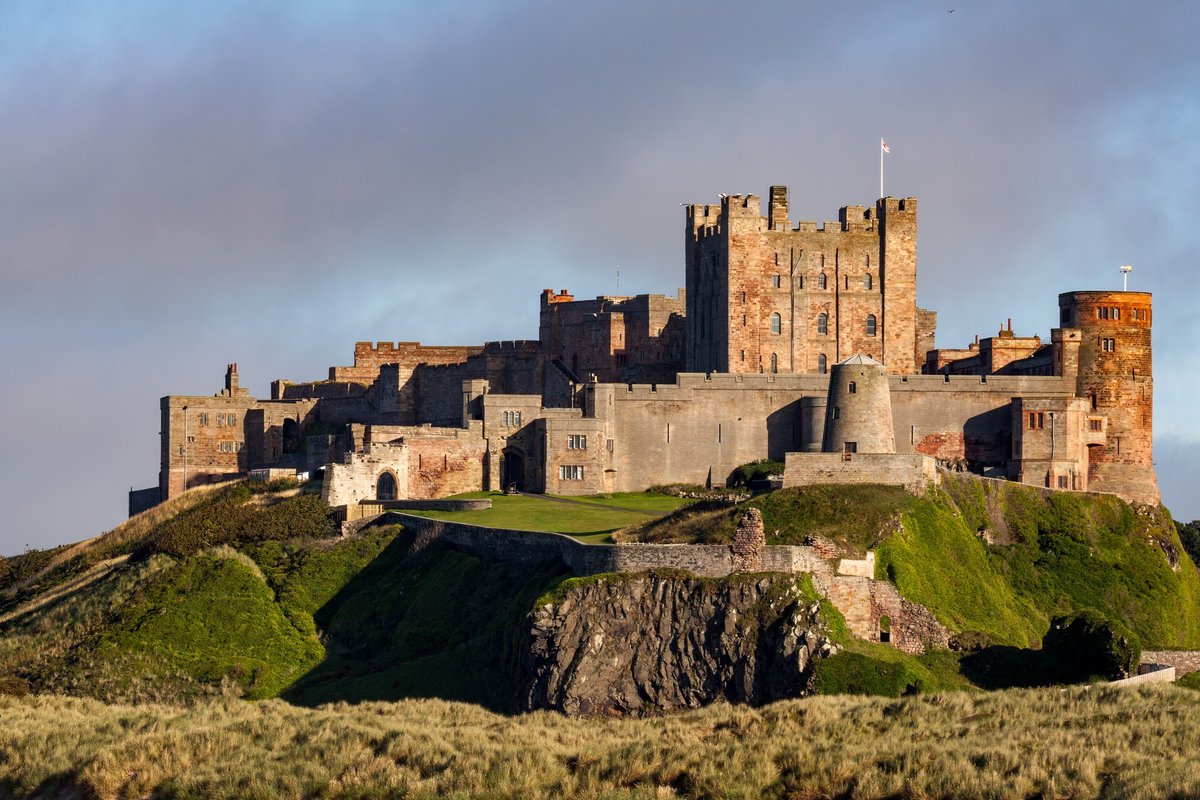 Secret - Rising from the sands like a guardian of the coast, Bamburgh ...
