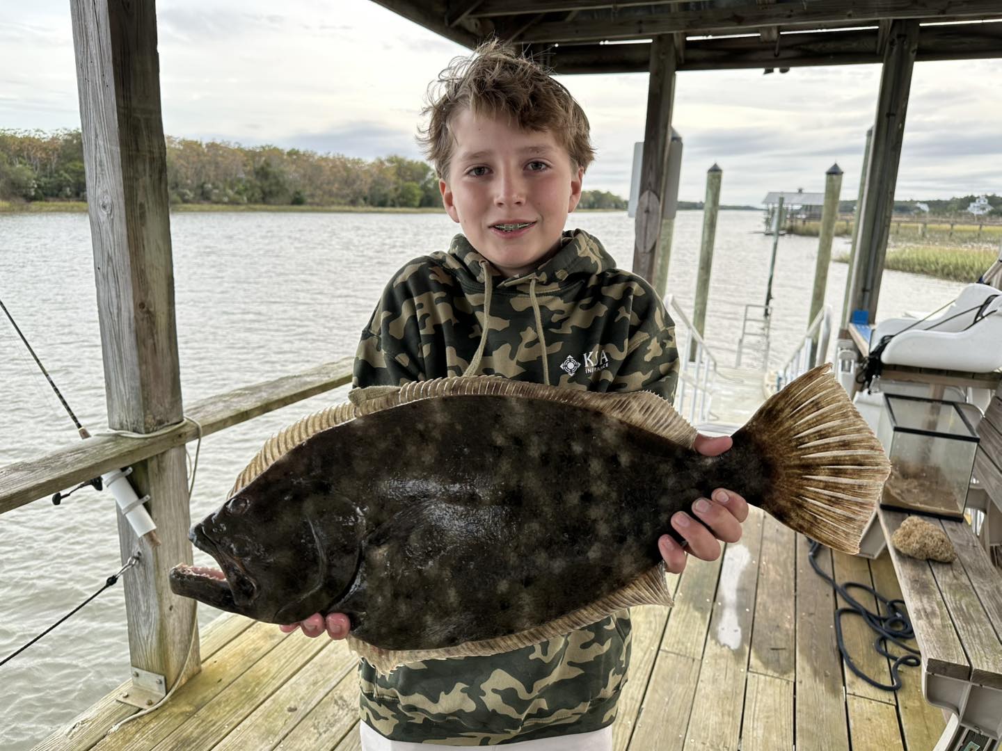 Haddrell's - Charlie with a XXL flounder caught on a piece of cut ...