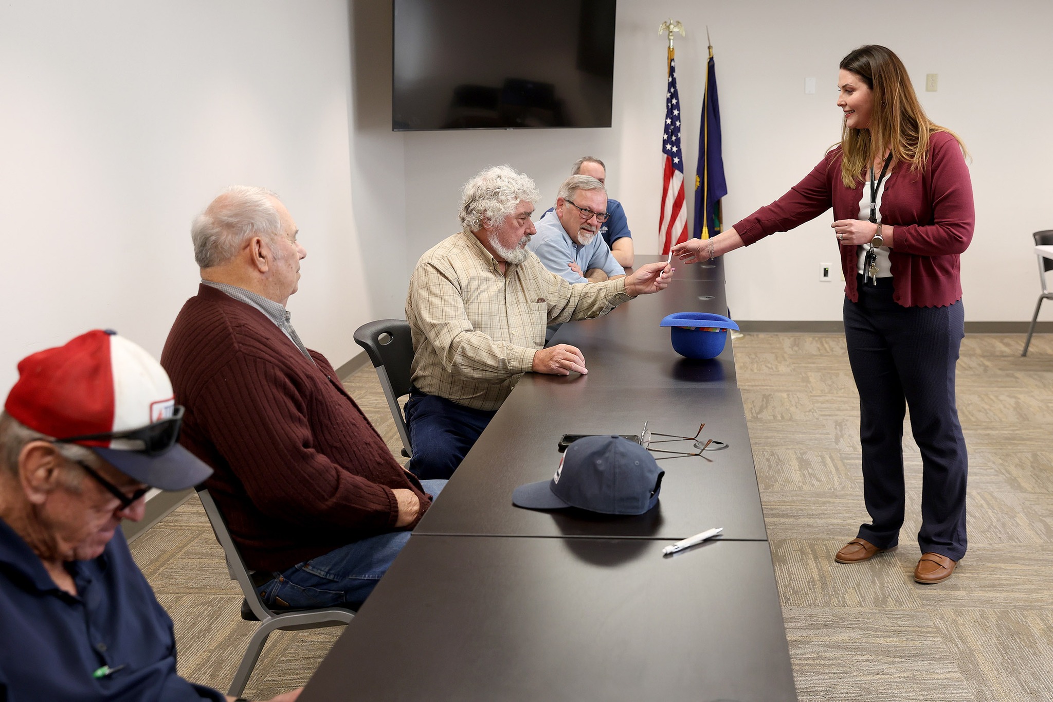 Reno - Reno County Commission Chairman Don Bogner hands the name to ...
