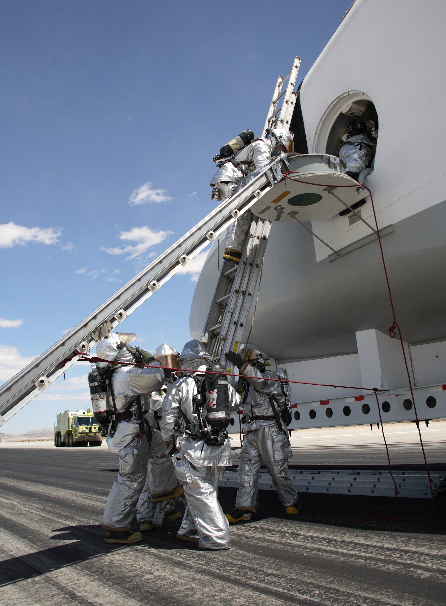 Blast - Air Force fire/rescue crew enter the space shuttle cabin mockup ...