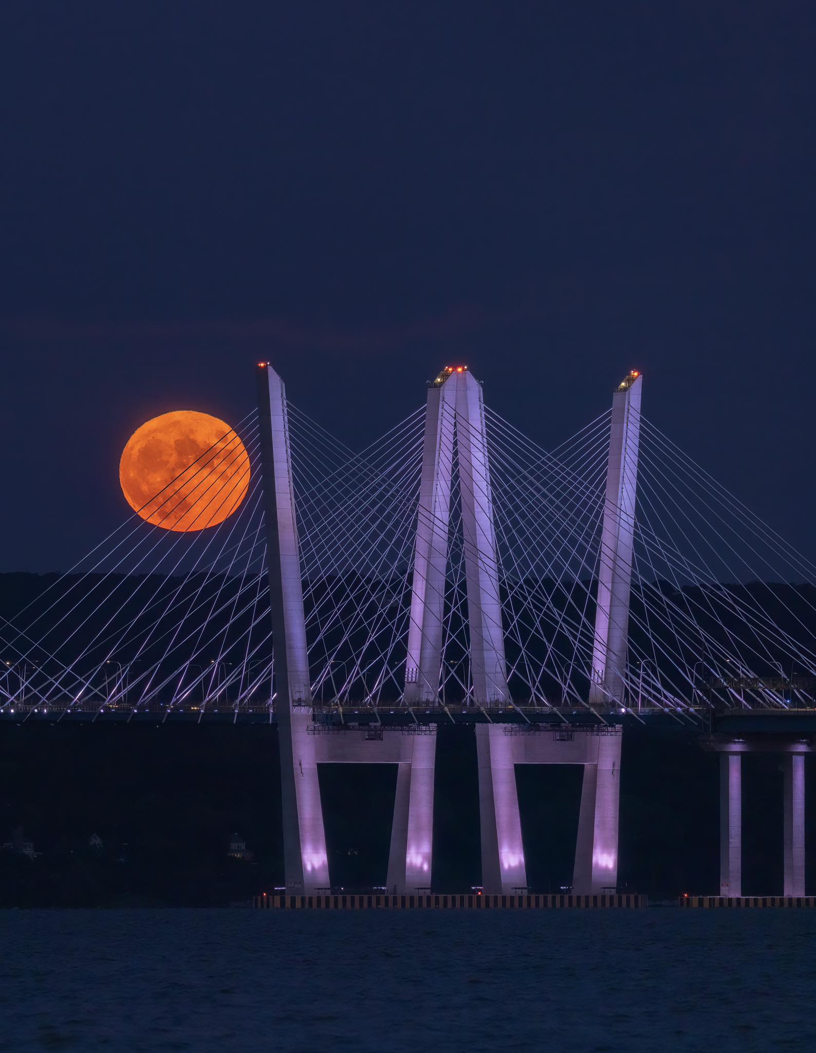 The full moon rising behind the Tappan Zee Bridge! • Photo by Mike