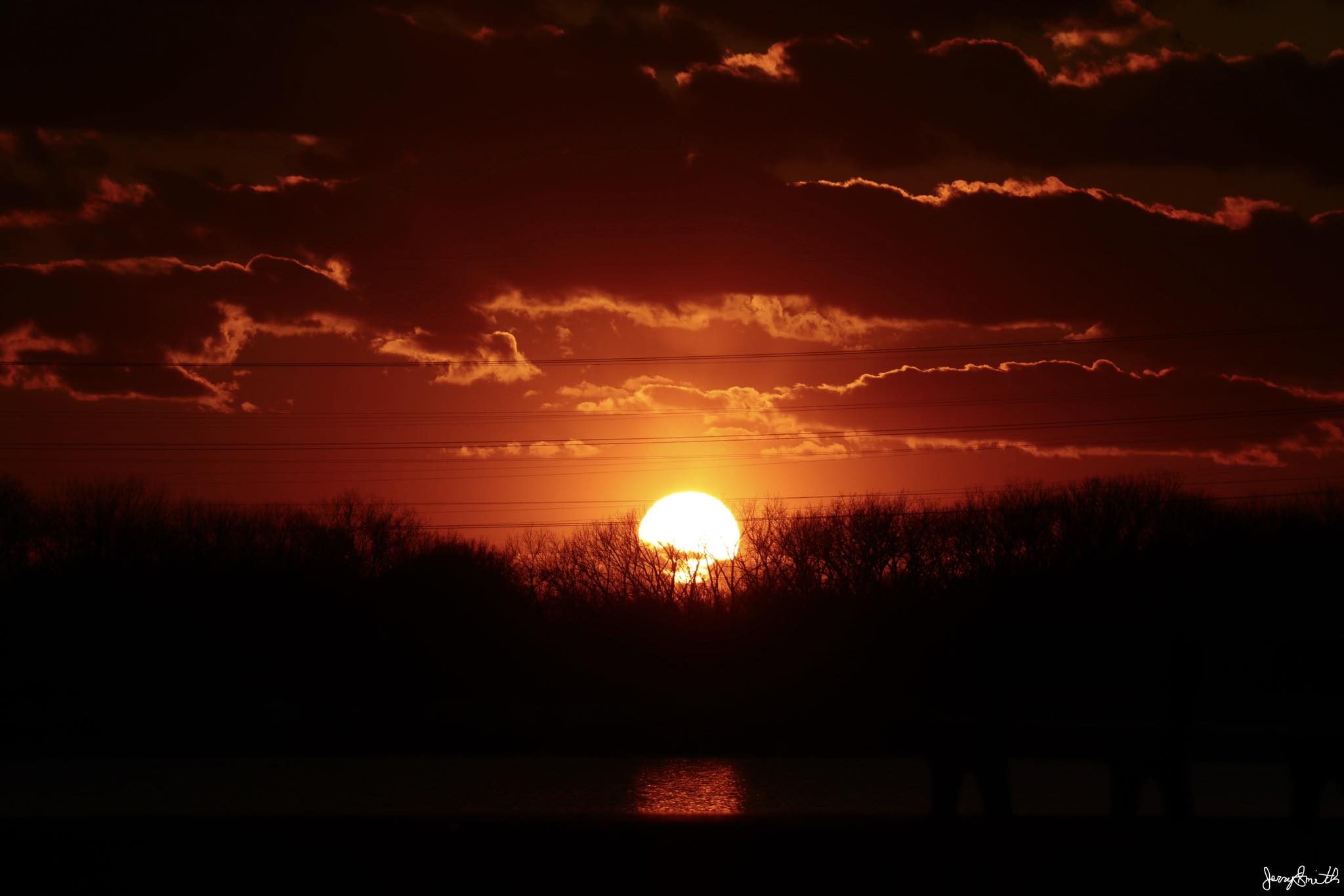 Fireball sunset going down over Wolf Lake in Hammond, IN USA 3-27 