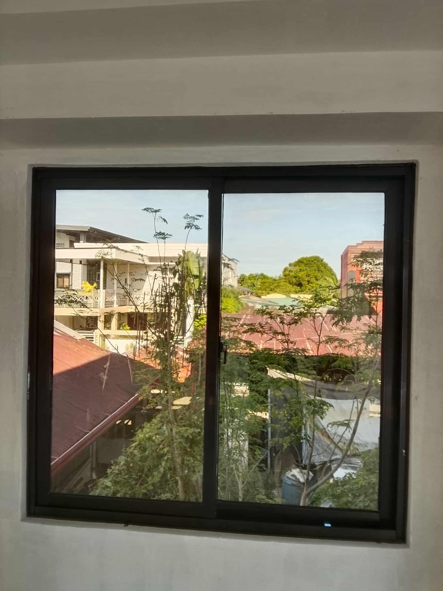 Starlite - 798 series sliding window with reflective bronze glass ...