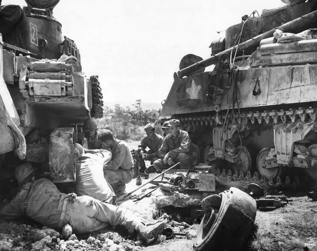 The crew of M32 tank recovery vehicle and US Marines repairing a