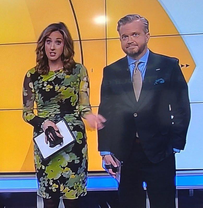 What colors are the dress, black and yellow or black and green?
