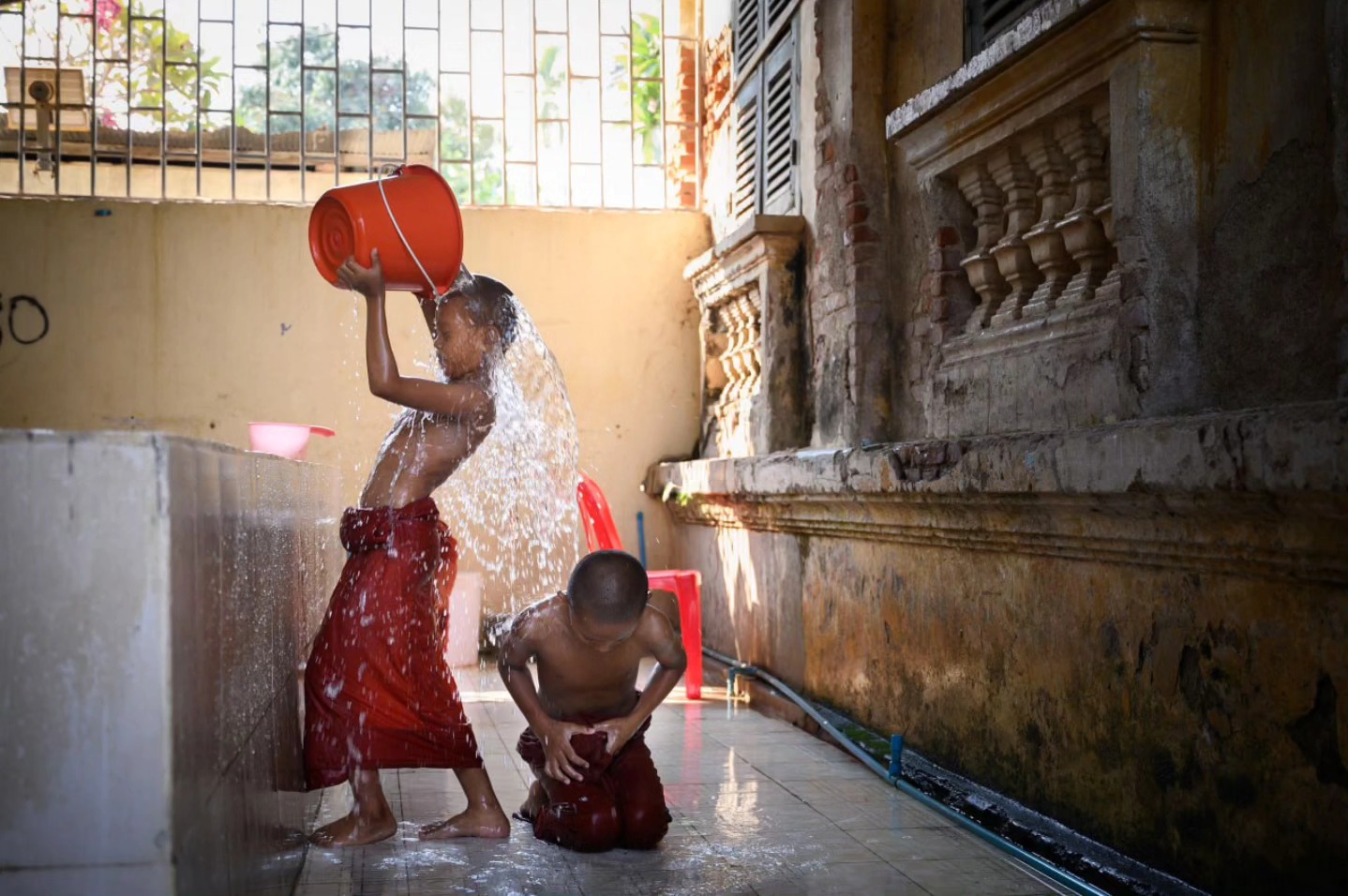 Angkor - Pure joy young monks bathe, laughter echoes. Captured on tour ...