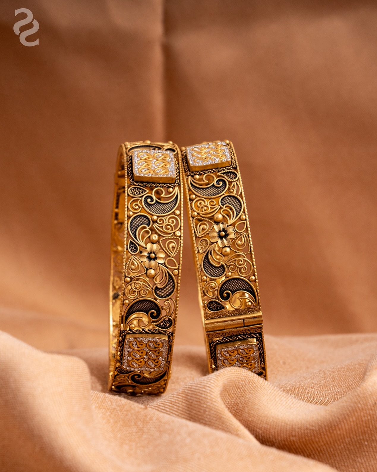 Grace from a golden era. This antique gold bangle tells a story of 