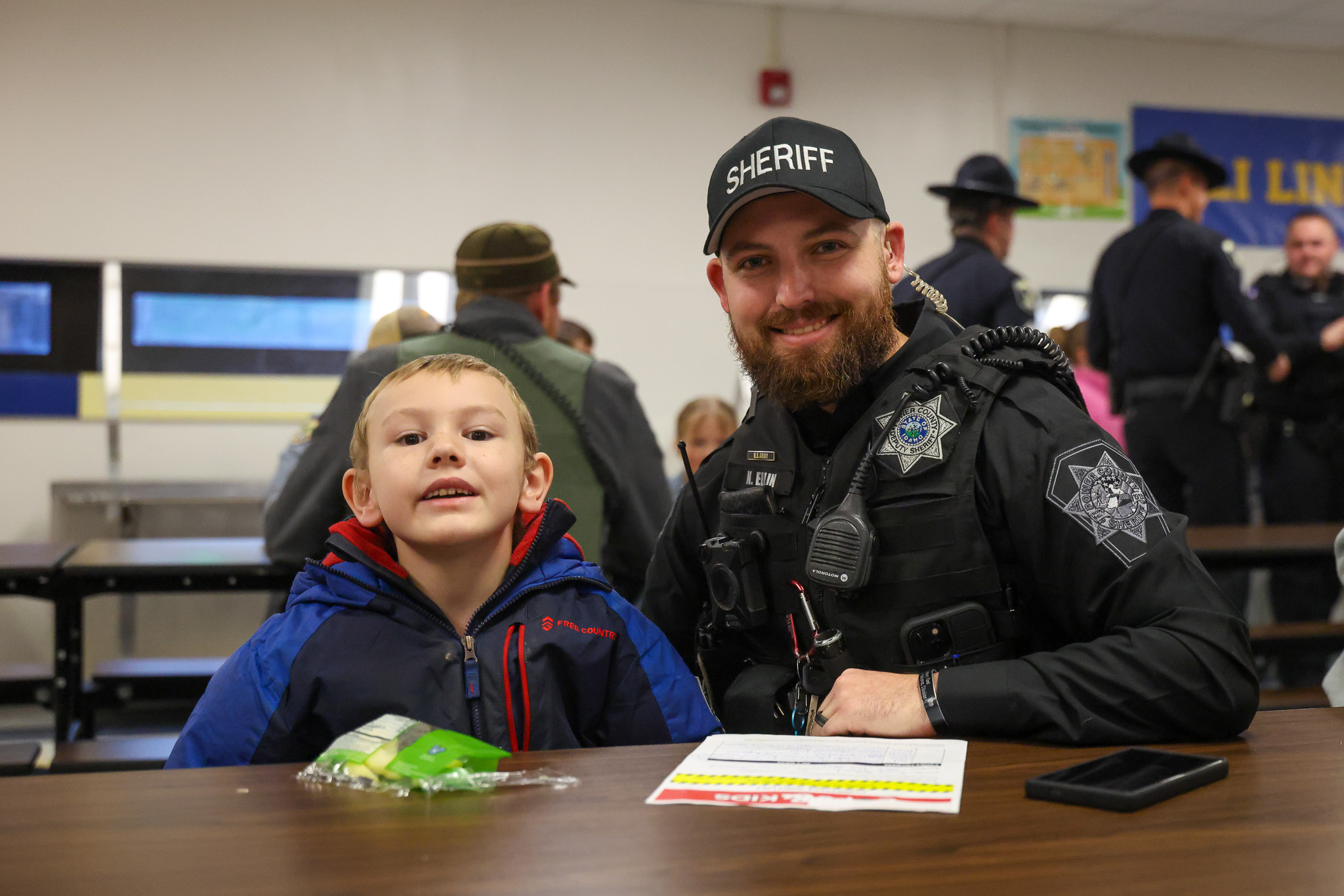 East - A Power County Sheriff’s Office deputy shares a moment with a ...