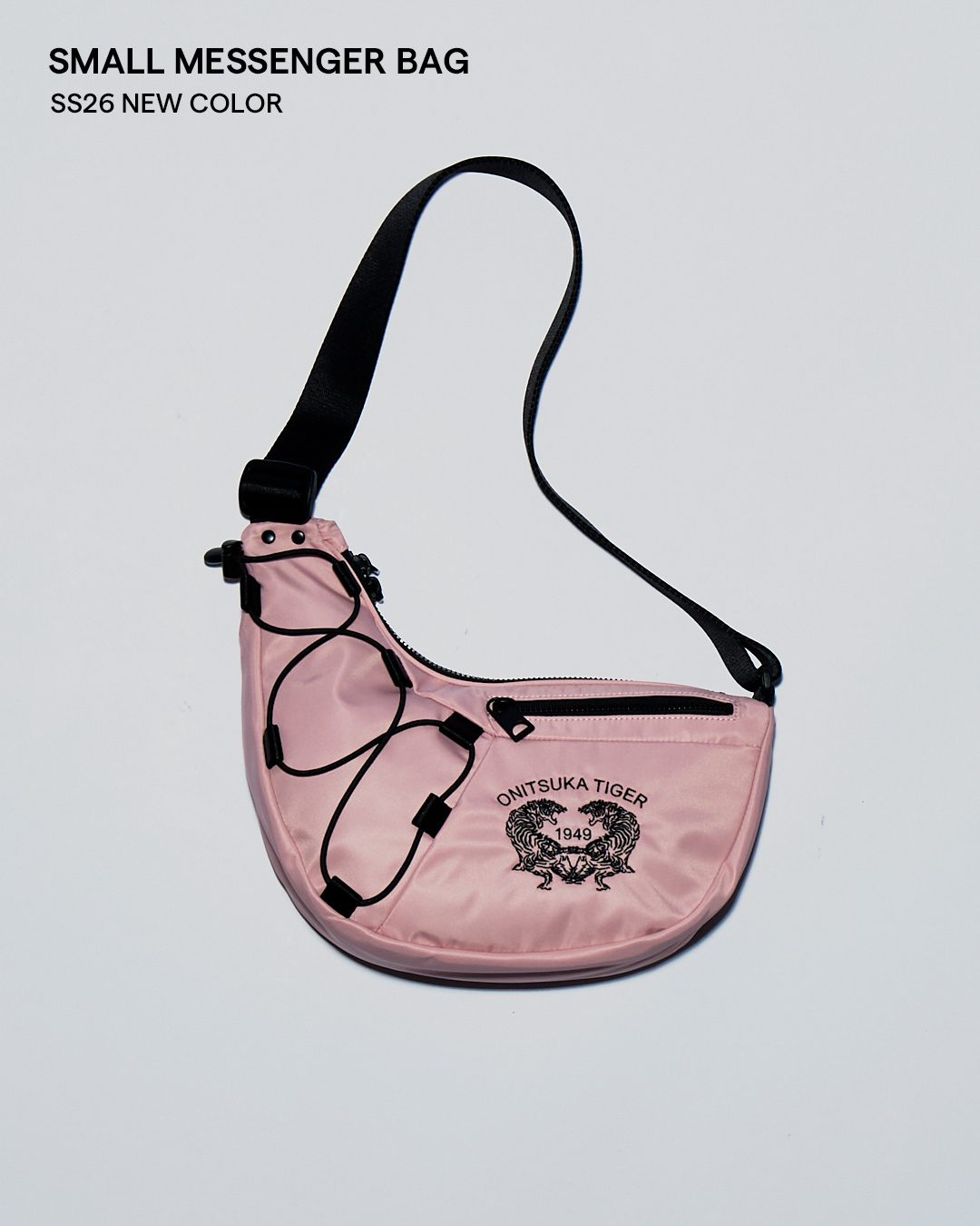 SMALL MESSENGER BAG LIGHT PINK/BLACK A compact messenger bag