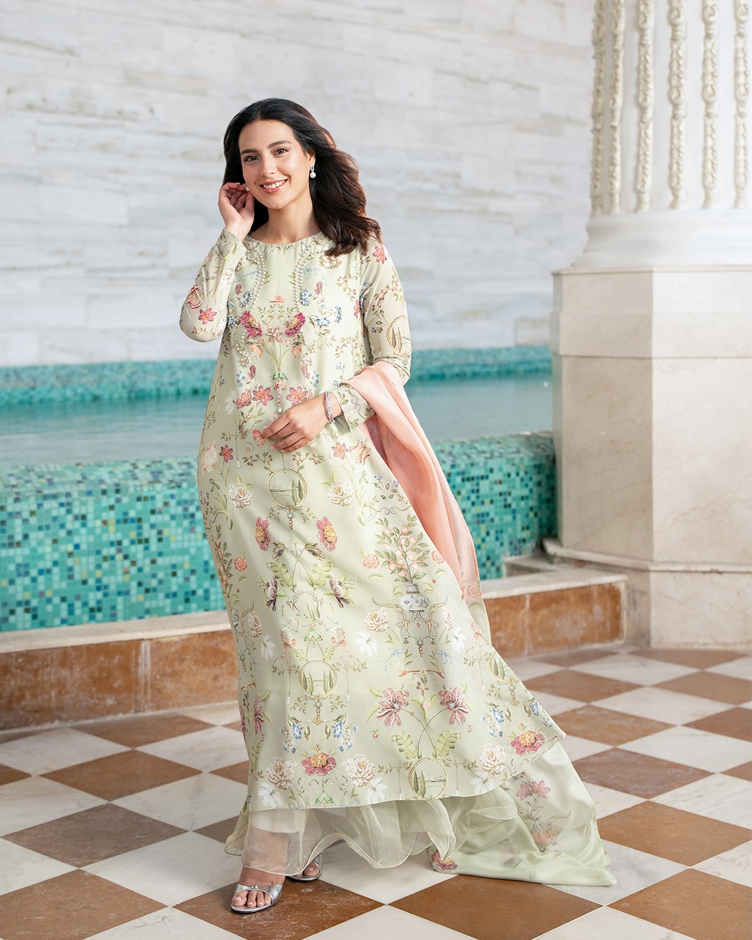 iqra aziz green dress Eid Featuring Fresh, floral, and effortlessly elegant A light silhouette touched with peachy and pink blooms. Shop Now SD-10.29.25