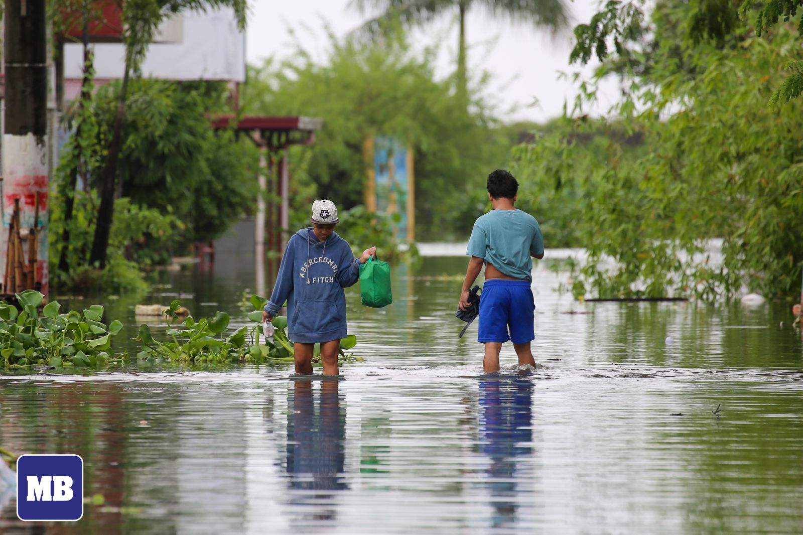 MANILA - LOOK: Residents of Angono, Rizal, wade through knee-to-waist ...