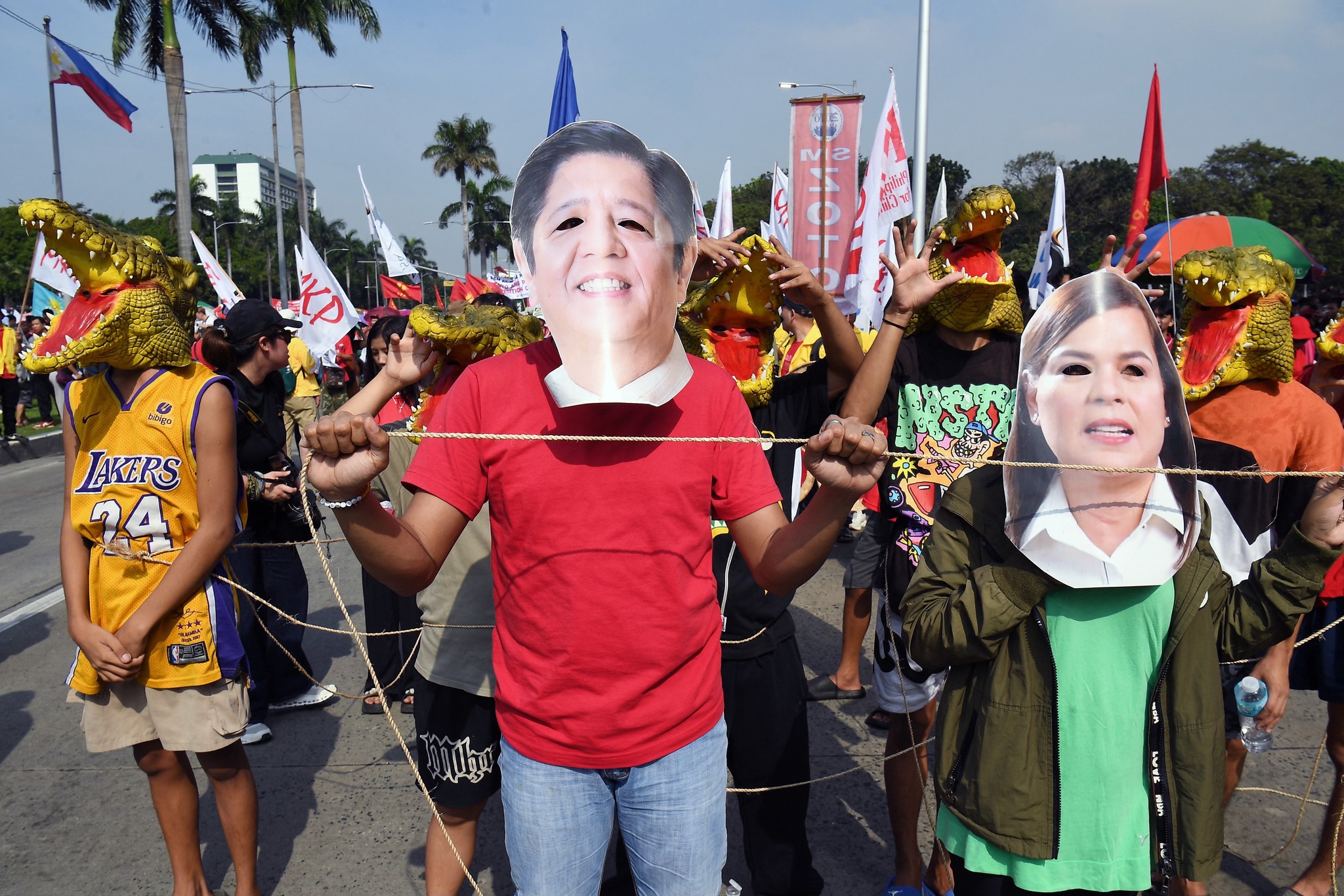 Philstar.com - Protesters carrying placards and wearing crocodile masks ...