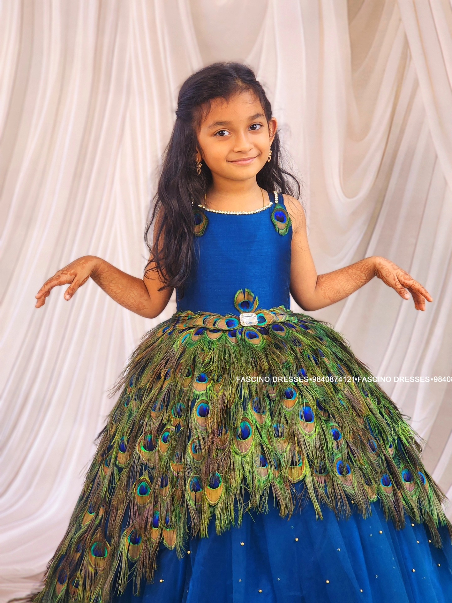 Our Viral Artificial peacock feather ballgown ...most asked by so many clients.... it's peacock blue this time!! from #fascinodresses🦚🦚🦚✨️ Ft cute Saanvika 💜 Inbox to order Can be customized in any color/size