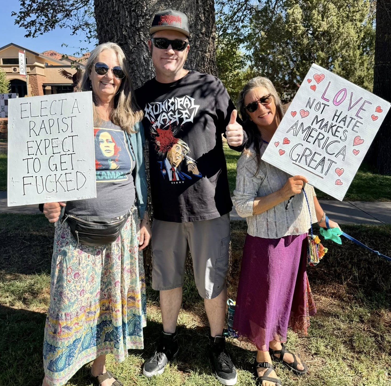 Kanab - The irony of the woman on the right's sign is amazing ...