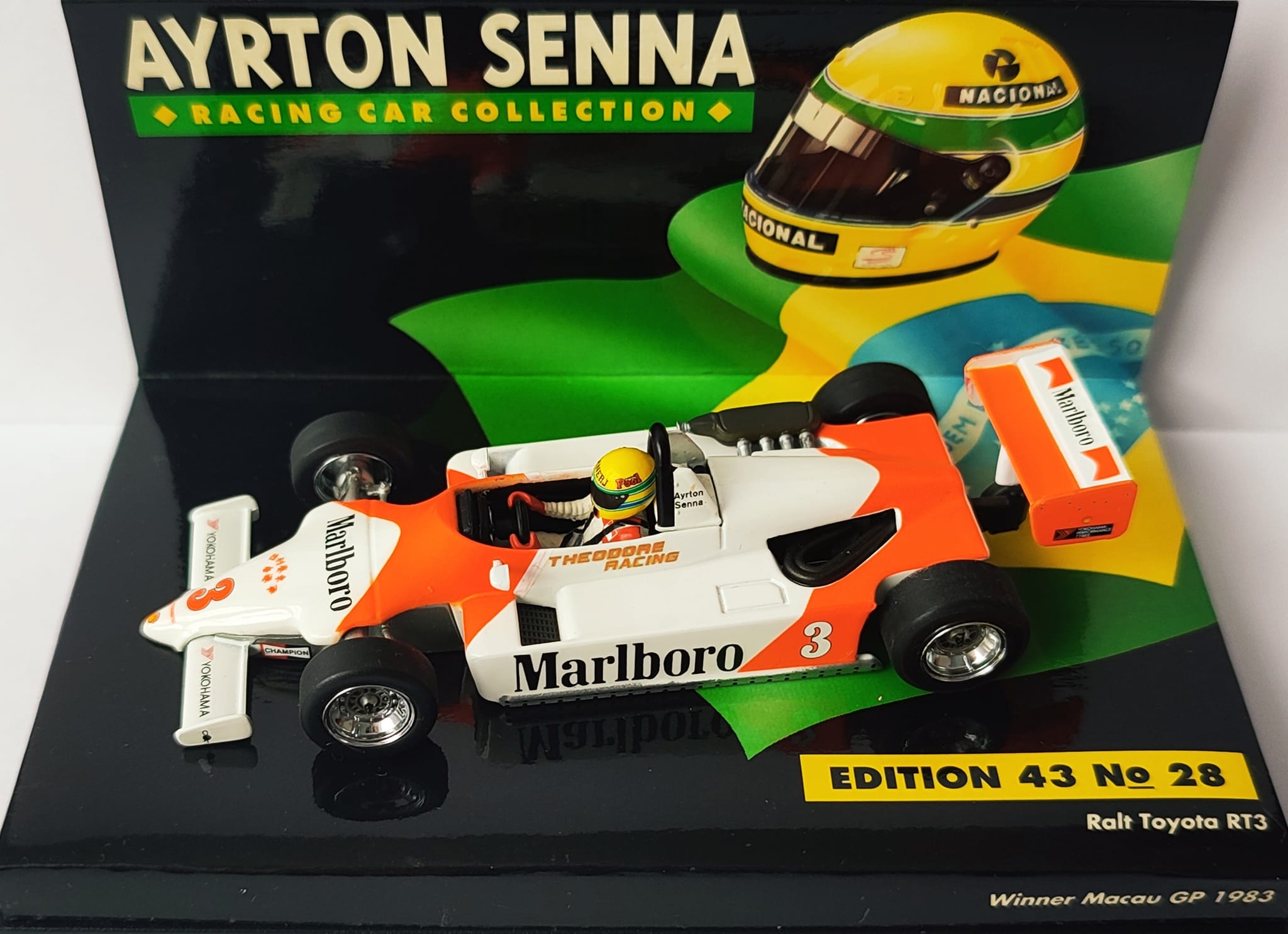 Ayrton Senna memorabilia collection with 1:18 cars and bronze memorial