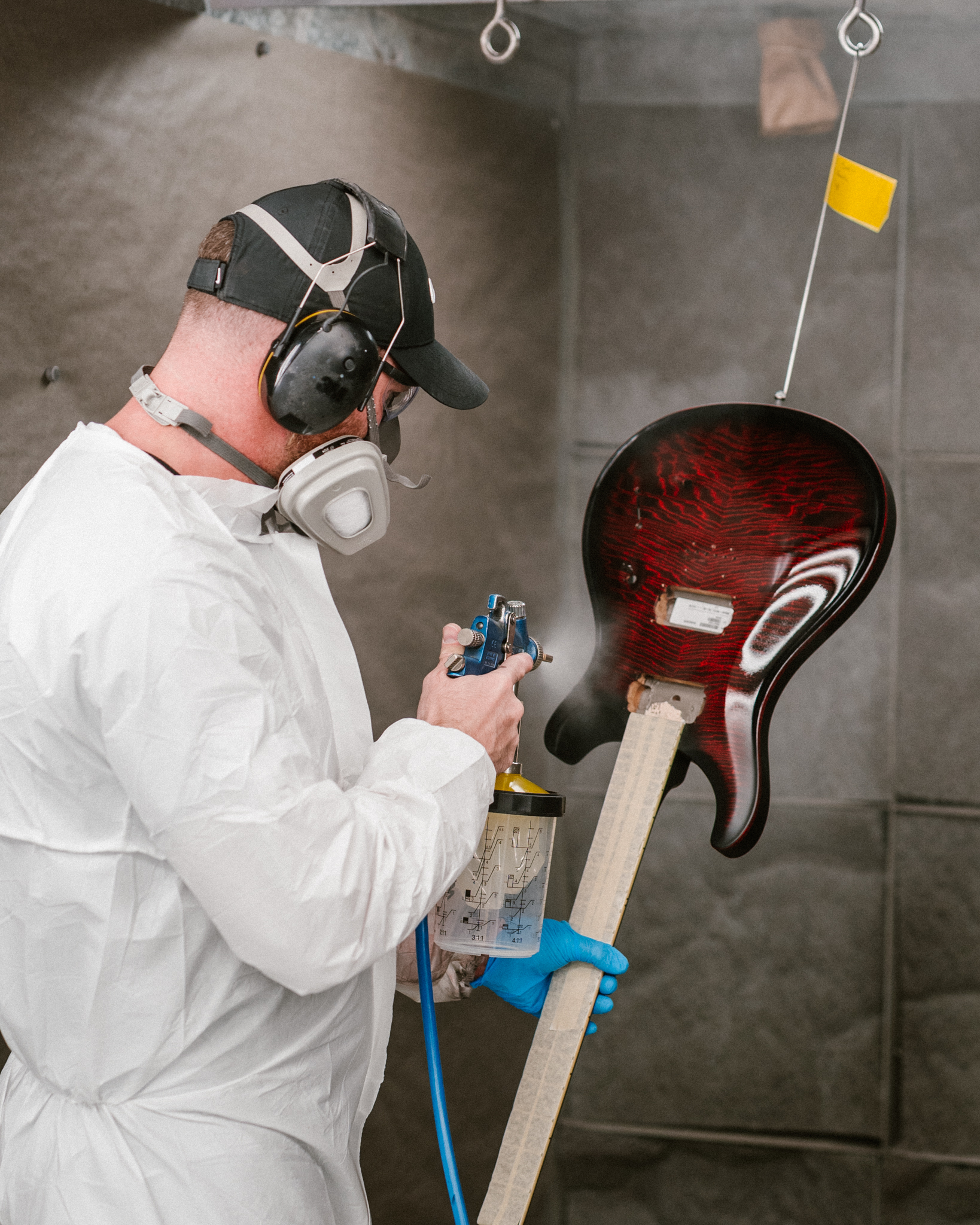 PRS Guitars - Behind the scenes with our stain and spray... | Facebook