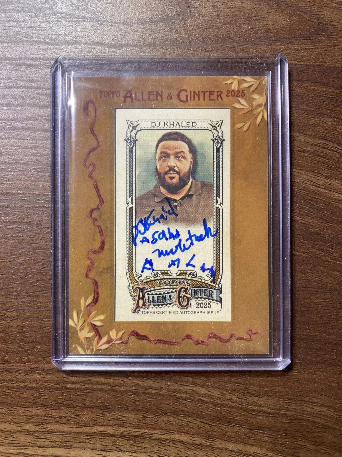 DJ Khaled signed this trading card with his sons 🥹
