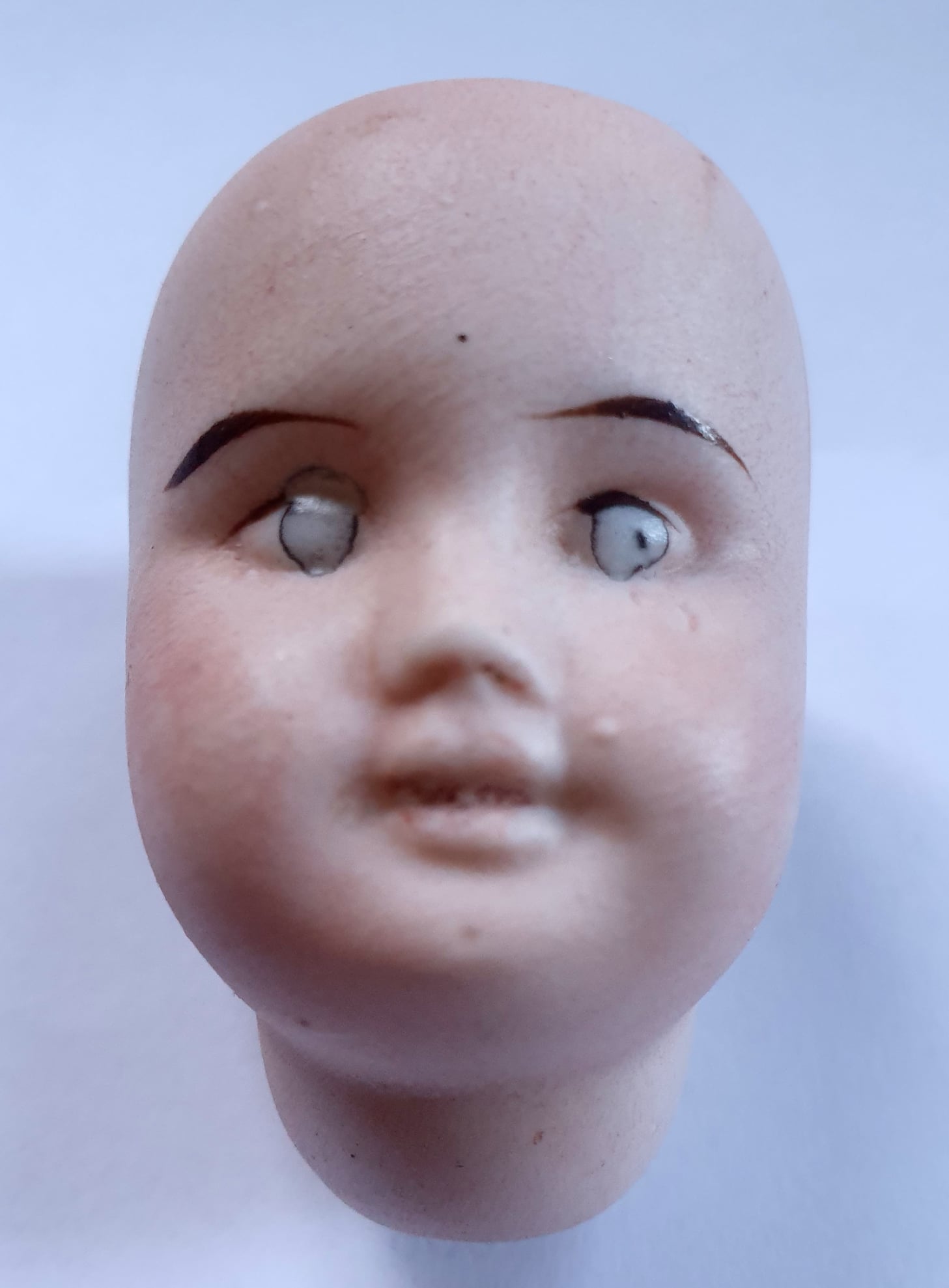 Tiny doll head found buried in yard
