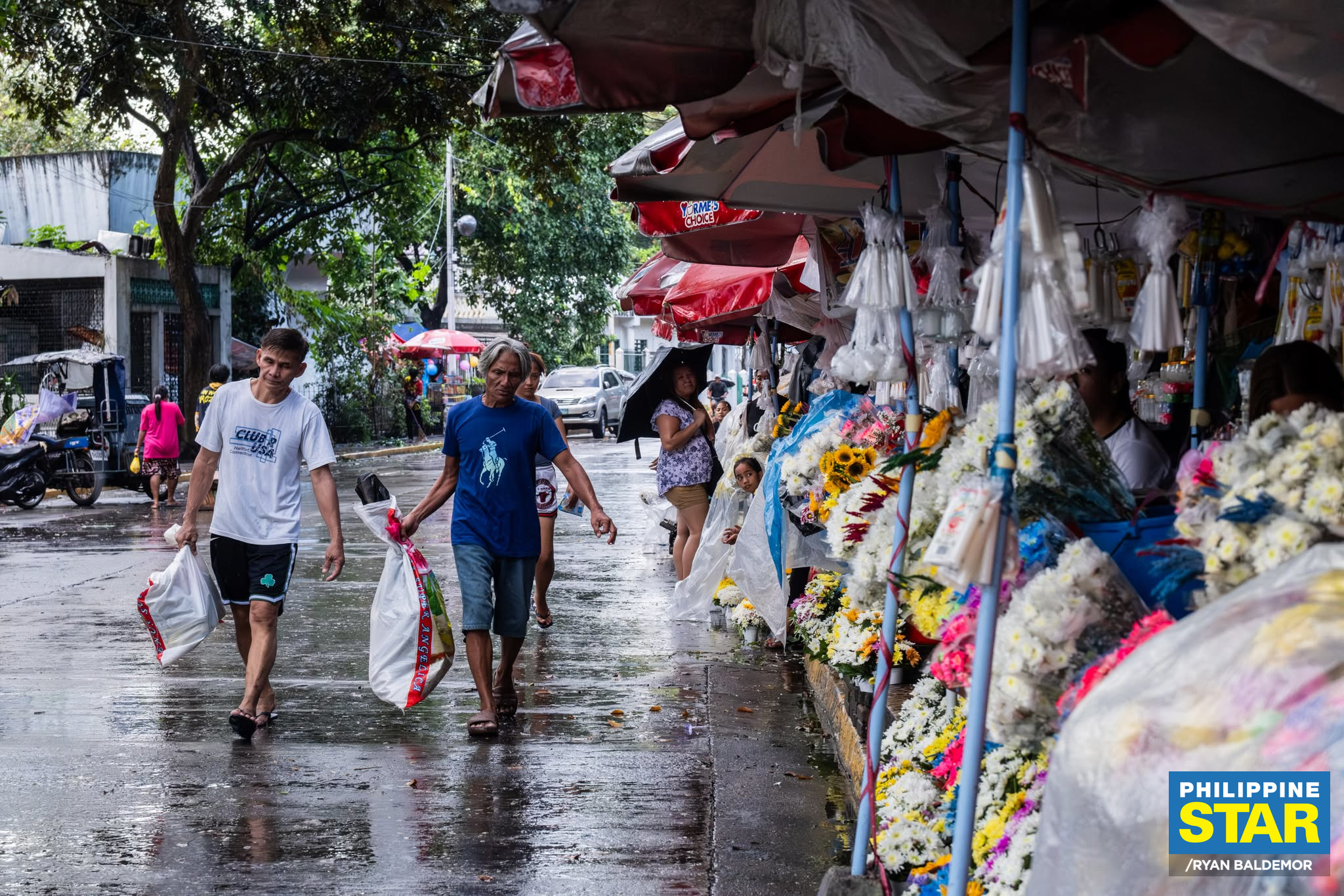Philippine - Individuals clean the tombs of their departed loved ones ...