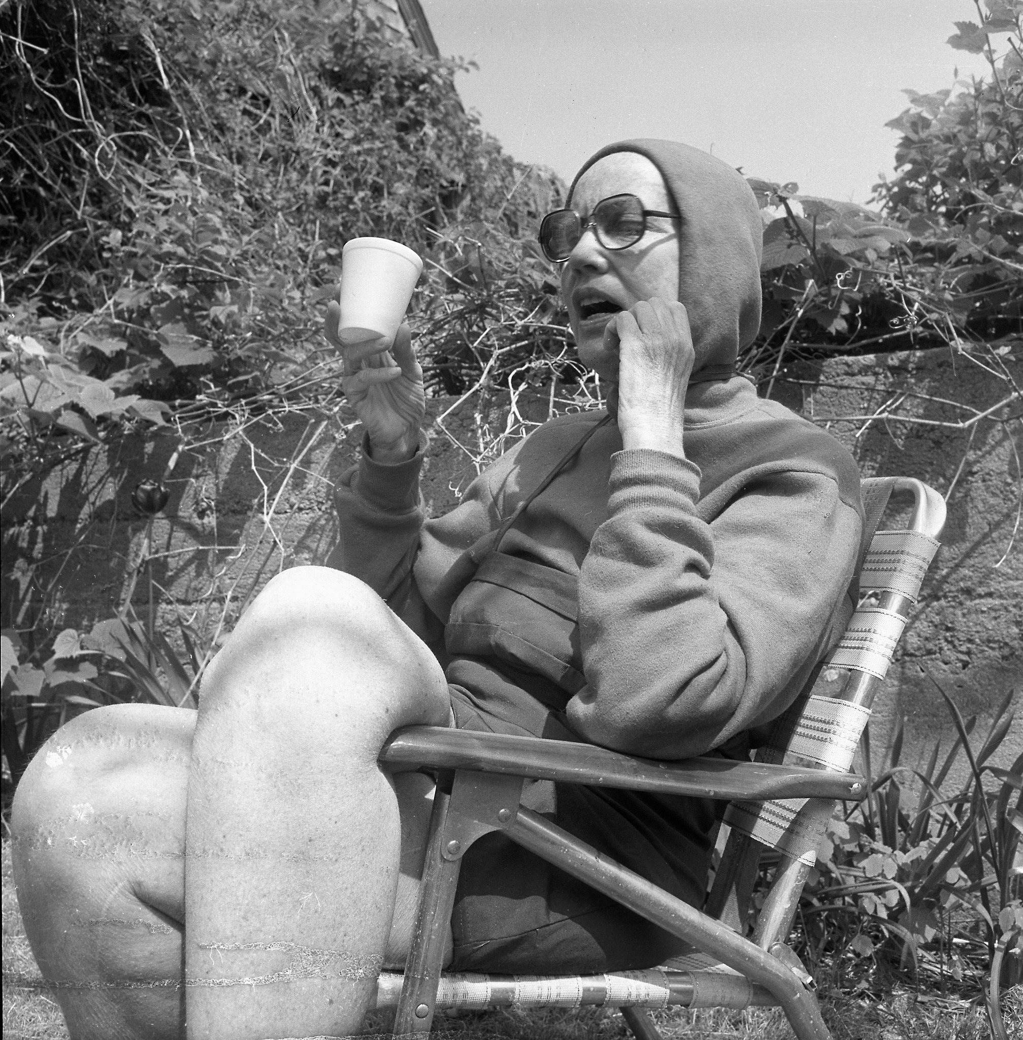 Staunch - A hoodied Edie Beale enjoying a beer in a white styrofoam cup ...