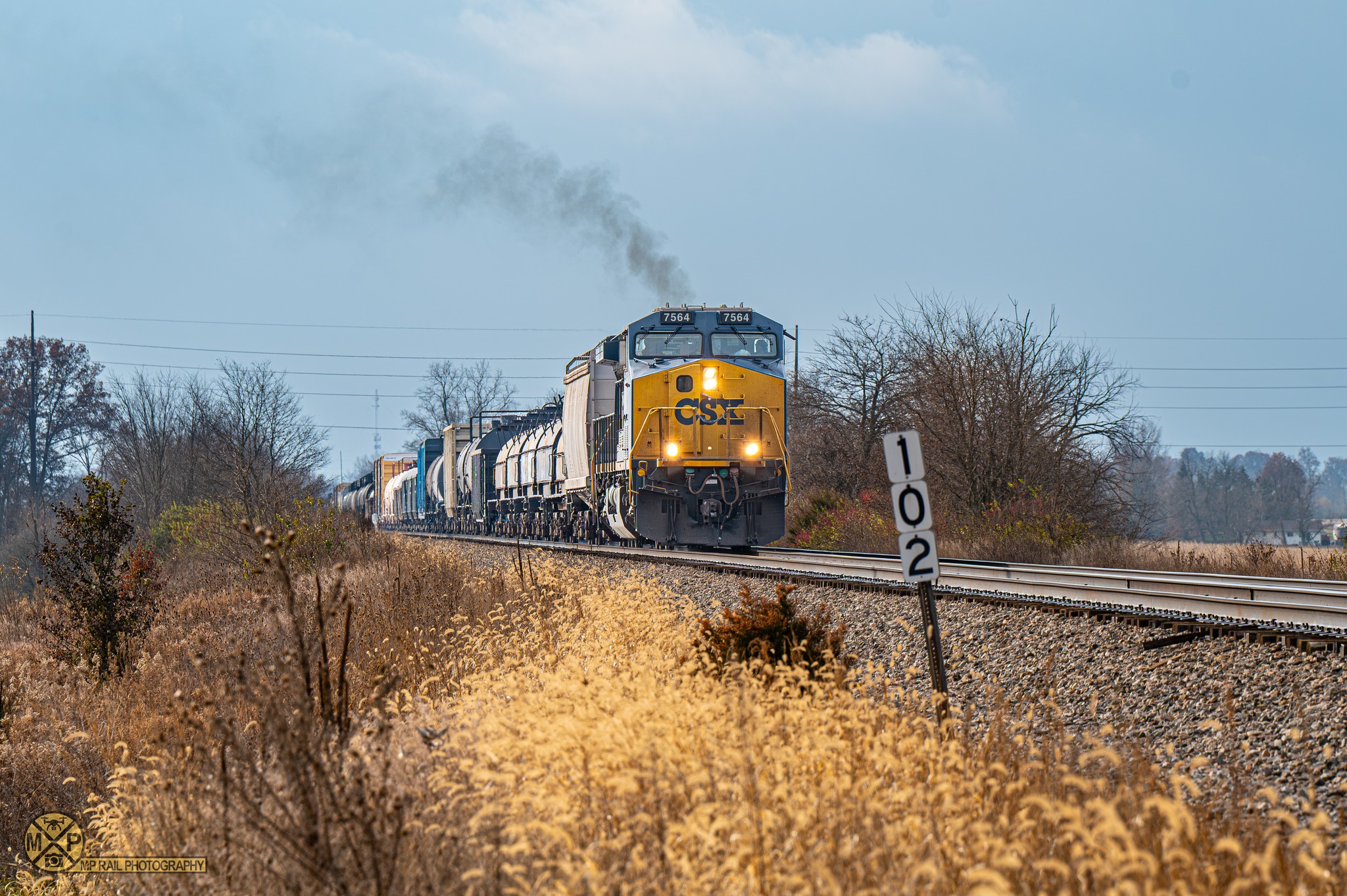 MP - After waiting on two trains at Swanders, CSX manifest M560 is seen ...