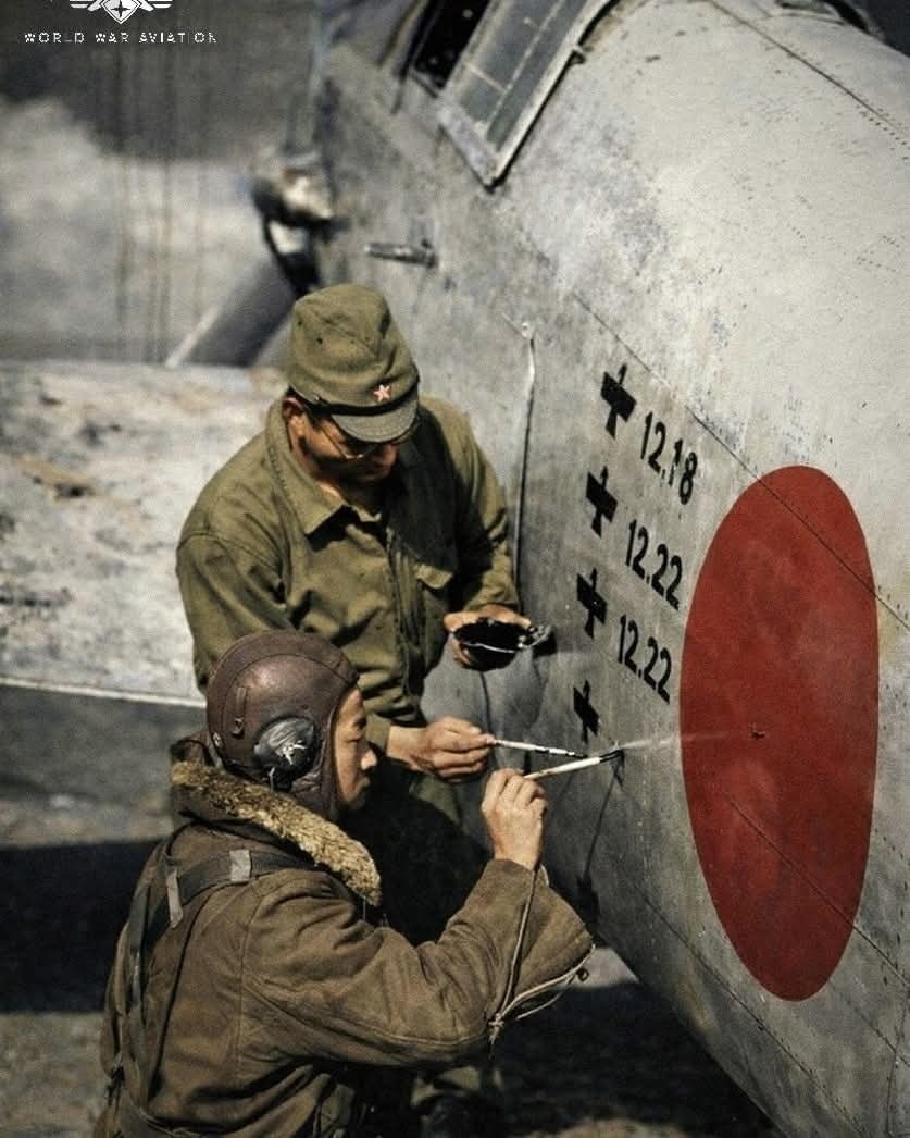 特撮 Writing in Action At Komaki Airfield, Japan, a pilot and crewman of the JAAS 244th