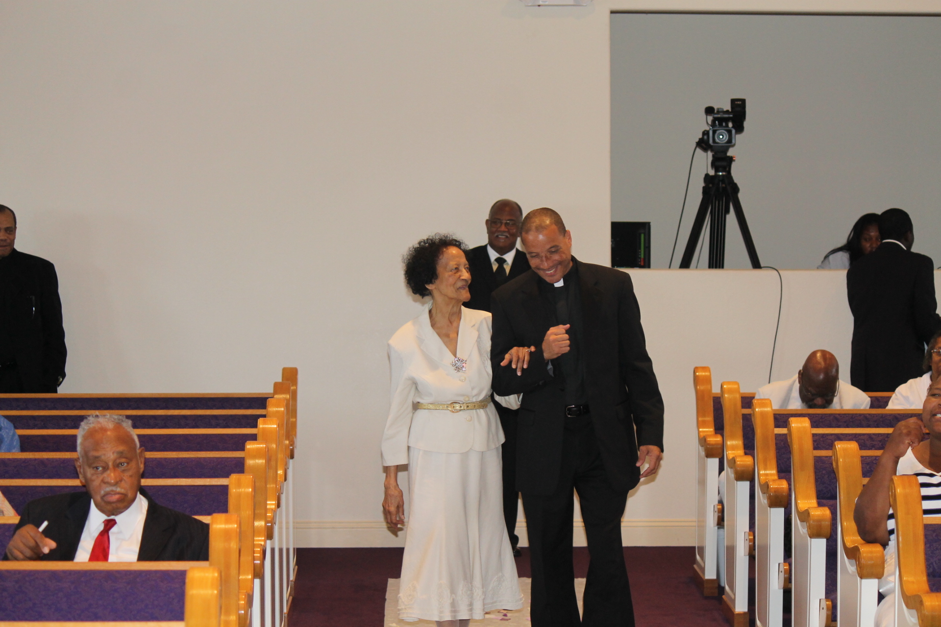 West - Escorted into the sanctuary by her youngest son and current ...