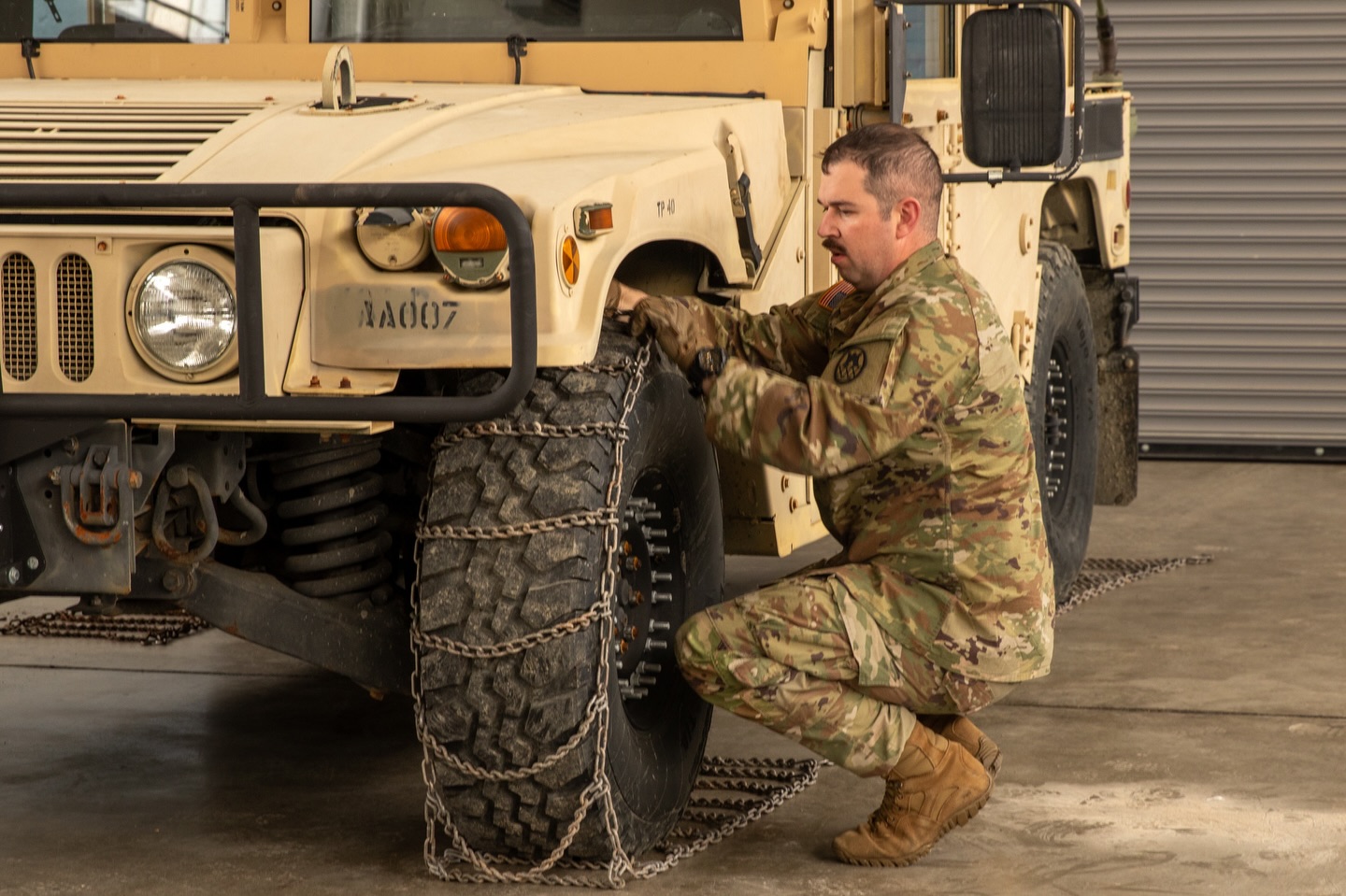 North - Spc. Ethan Ticer, 211th Military Police Company, mounts snow ...
