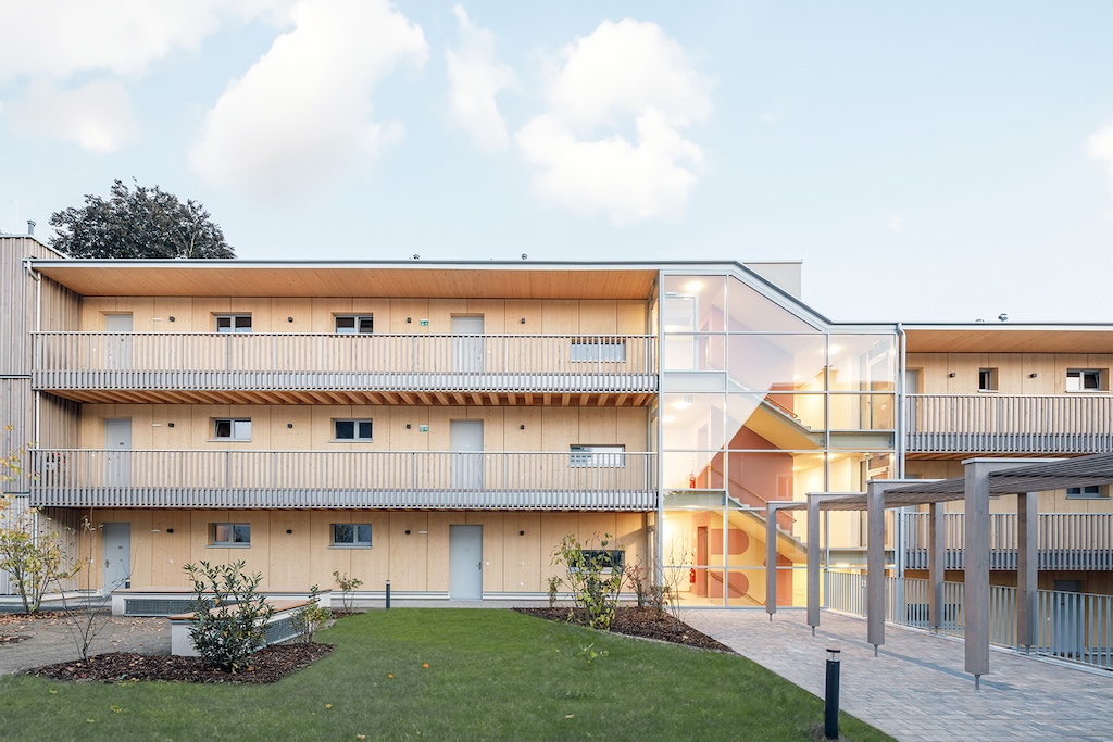 A housing block built almost entirely from wood demonstrates a