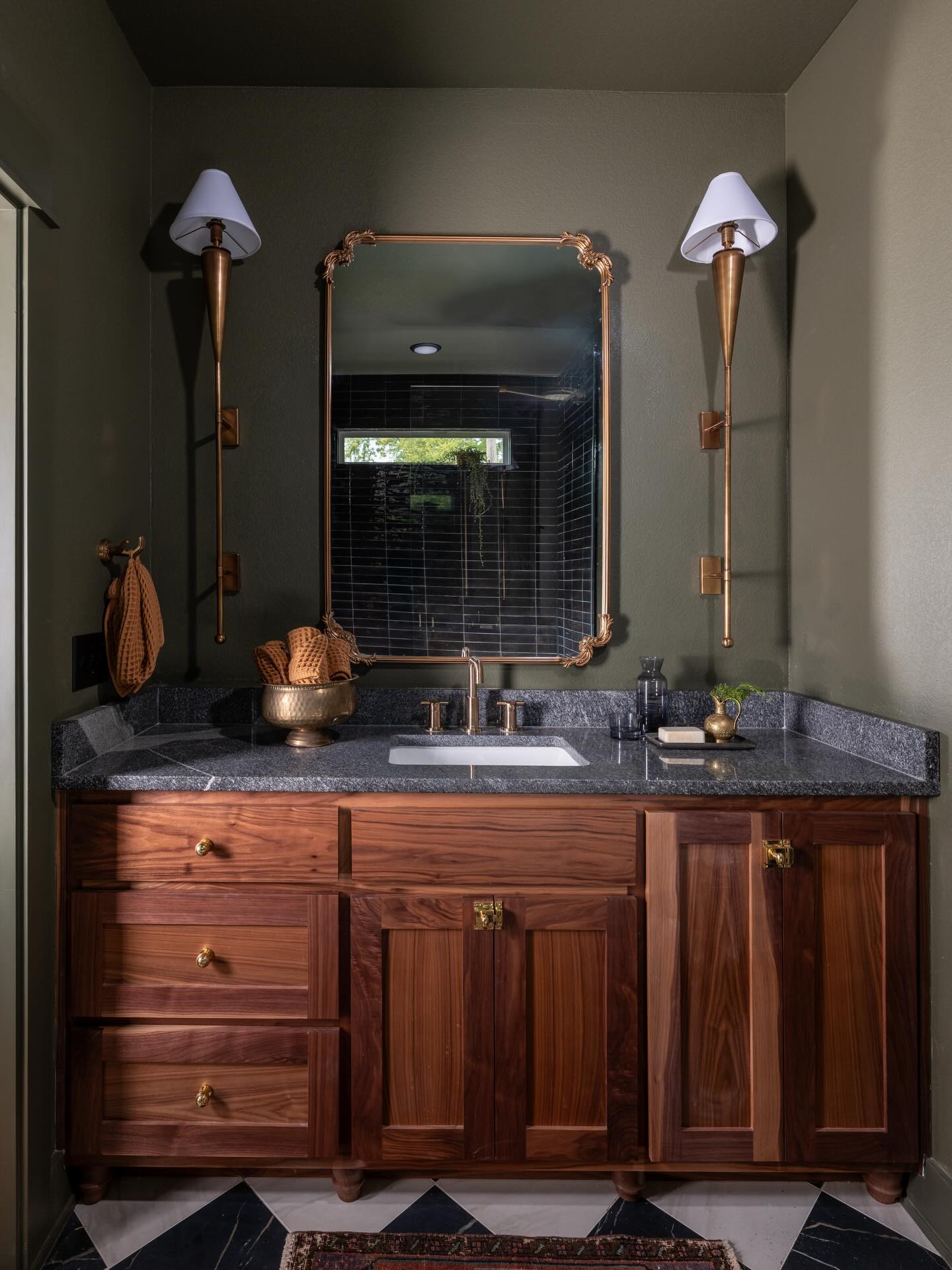This small bathroom packs in so much character. Dark shower tile  display picture 1