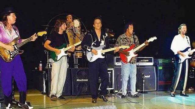 1990 photograph of Eric Clapton, Stevie Ray Vaughan and Robert