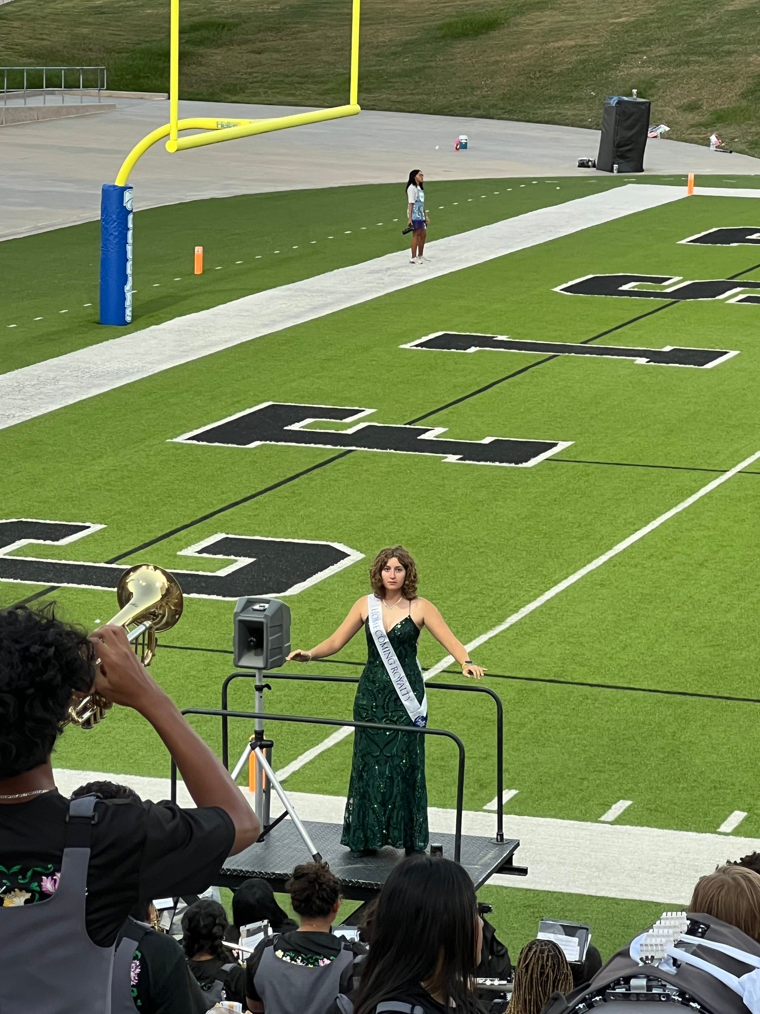 Julie - Love this - drum major conducting the band in her homecoming ...