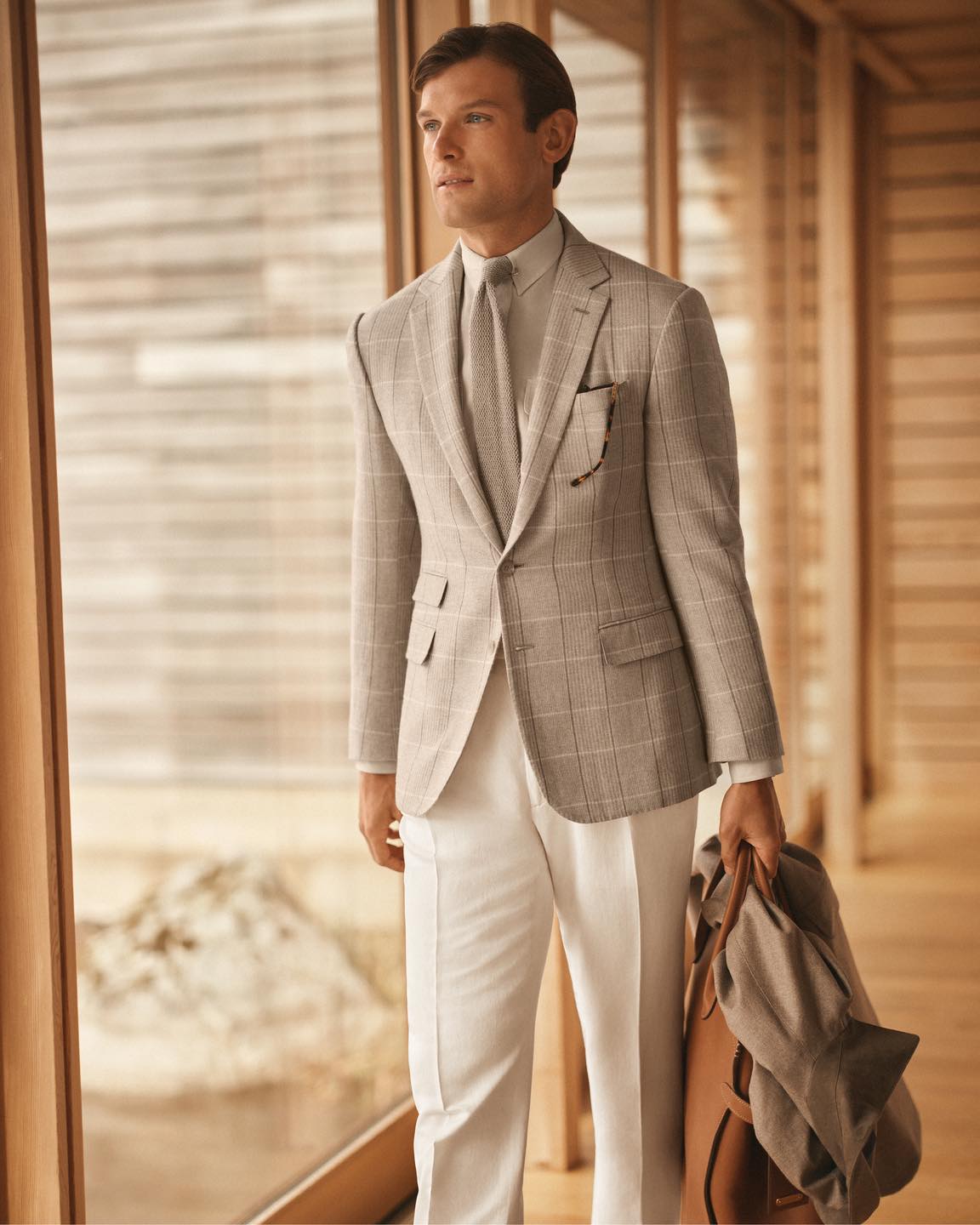 Styled with tassel loafers and linen, this plaid iteration of