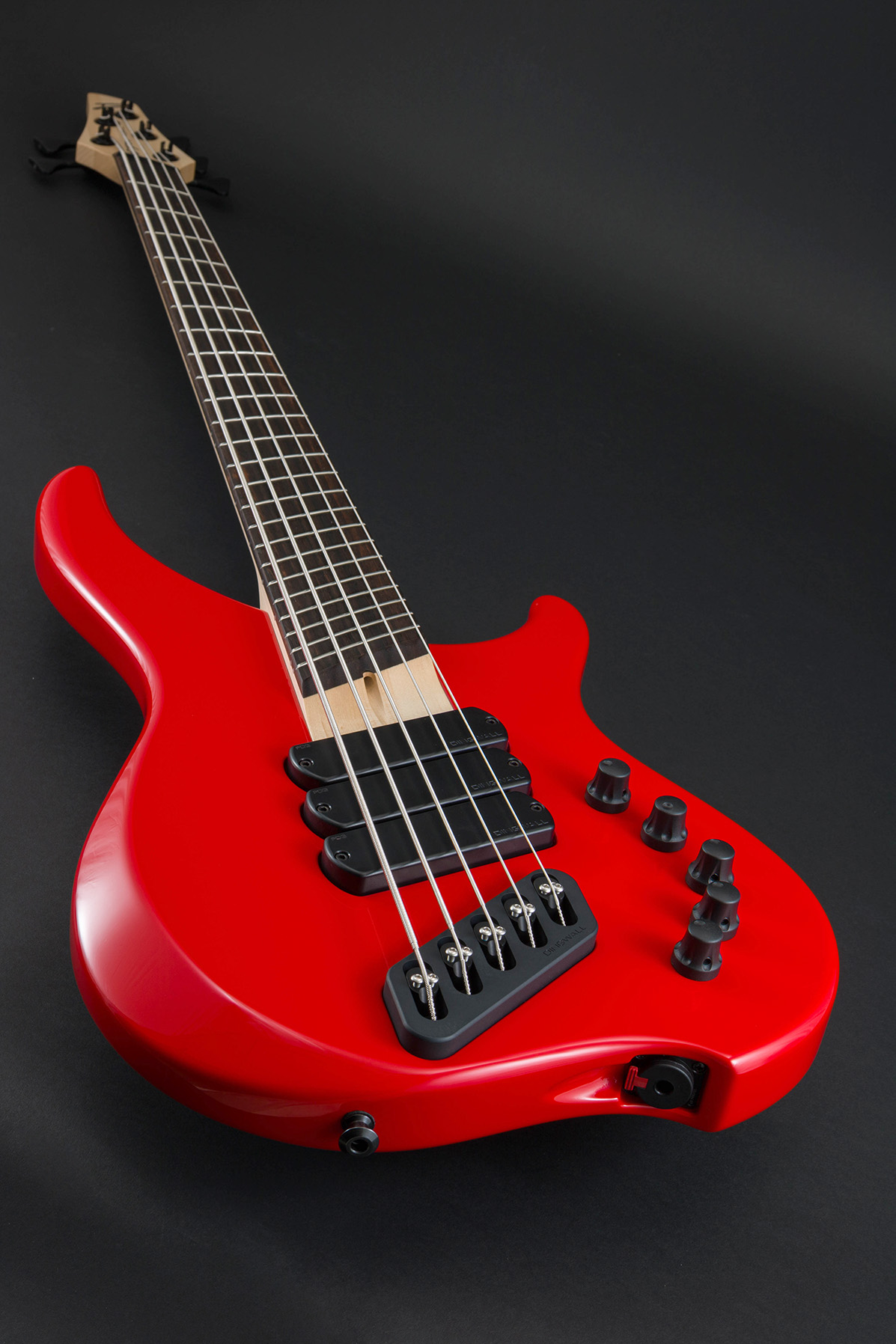 This ABI in a Ferrari Red finish has no fretboard inlays. Would