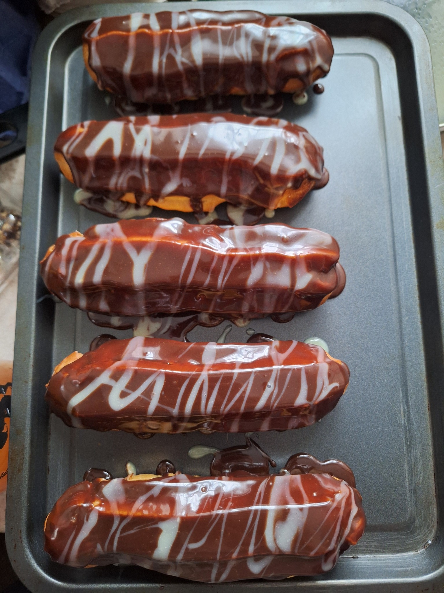 Vanilla filled Eclairs glased in... - Claudia’s Bakery | Facebook