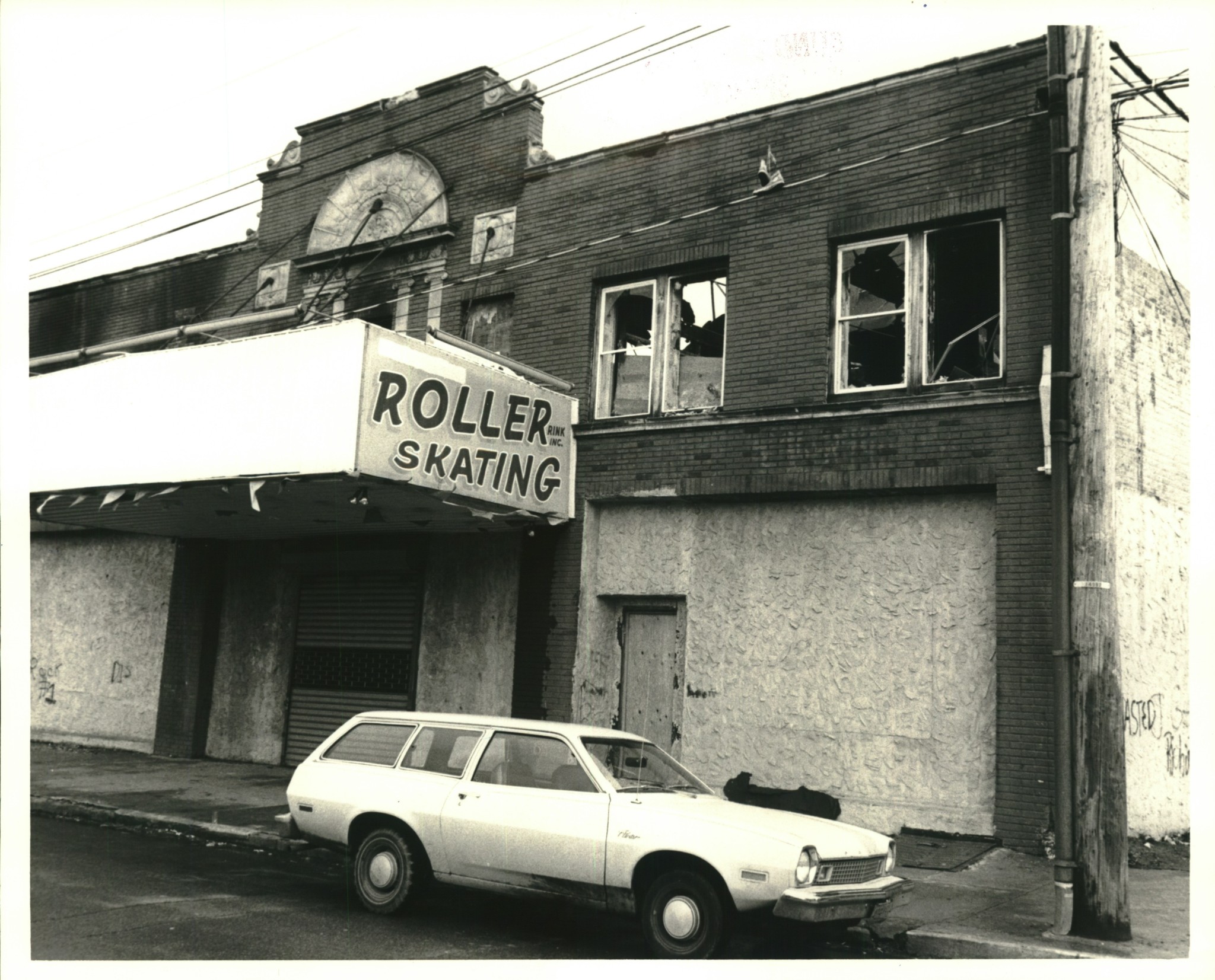 This roller rink, its windows broken and walls covered with