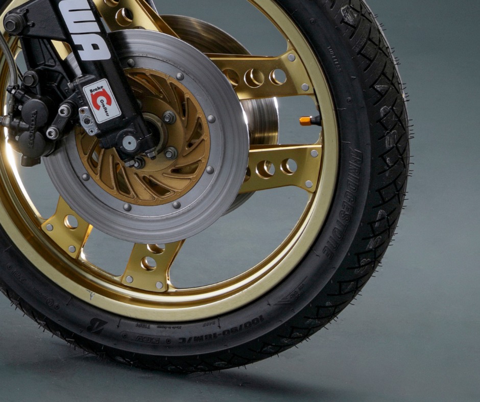 Van Komurka's classic Honda motorcycle with premium brake caliper