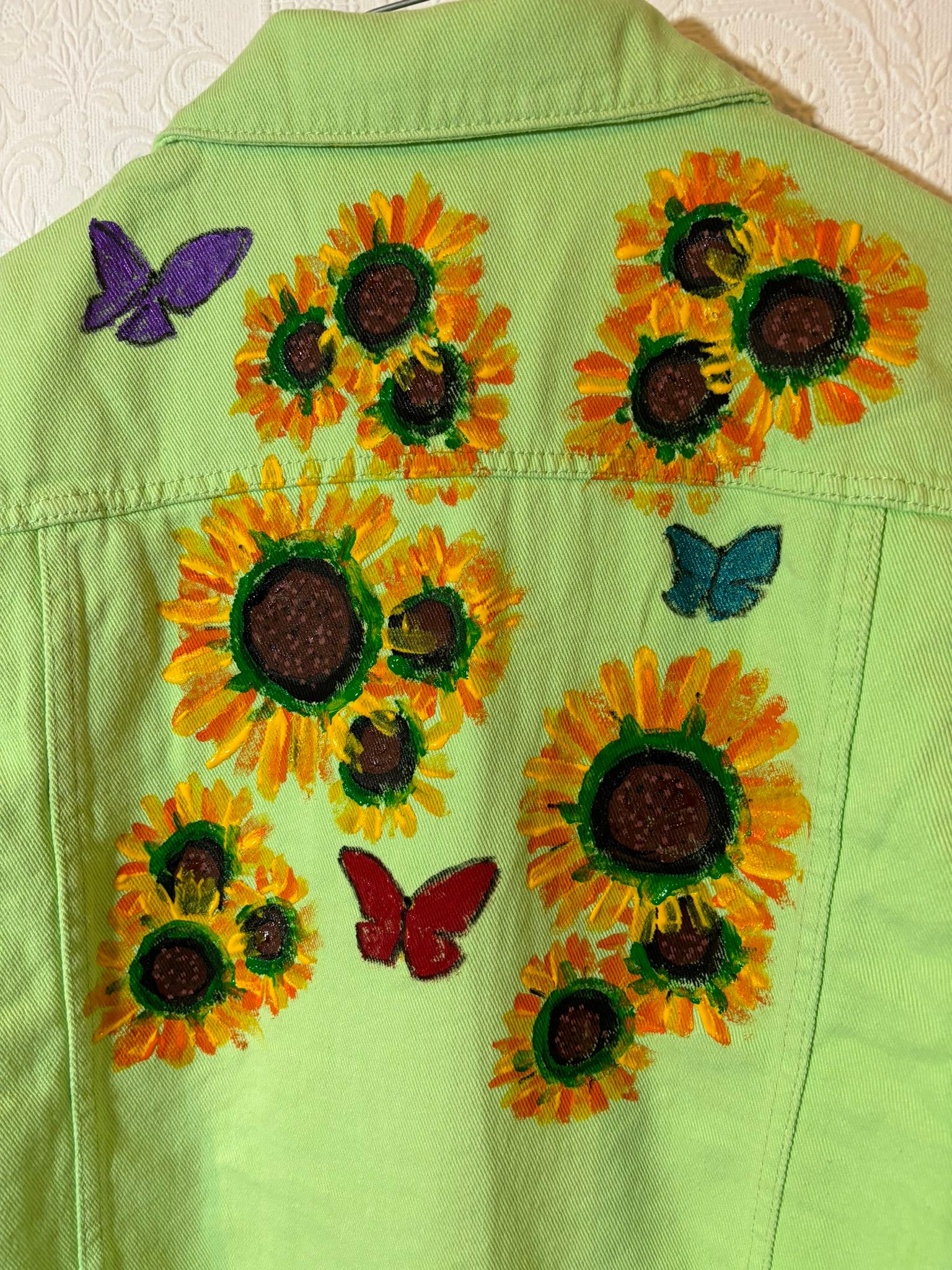 Hand painted sunflower and butterfly jacket by Andrew Jenkins