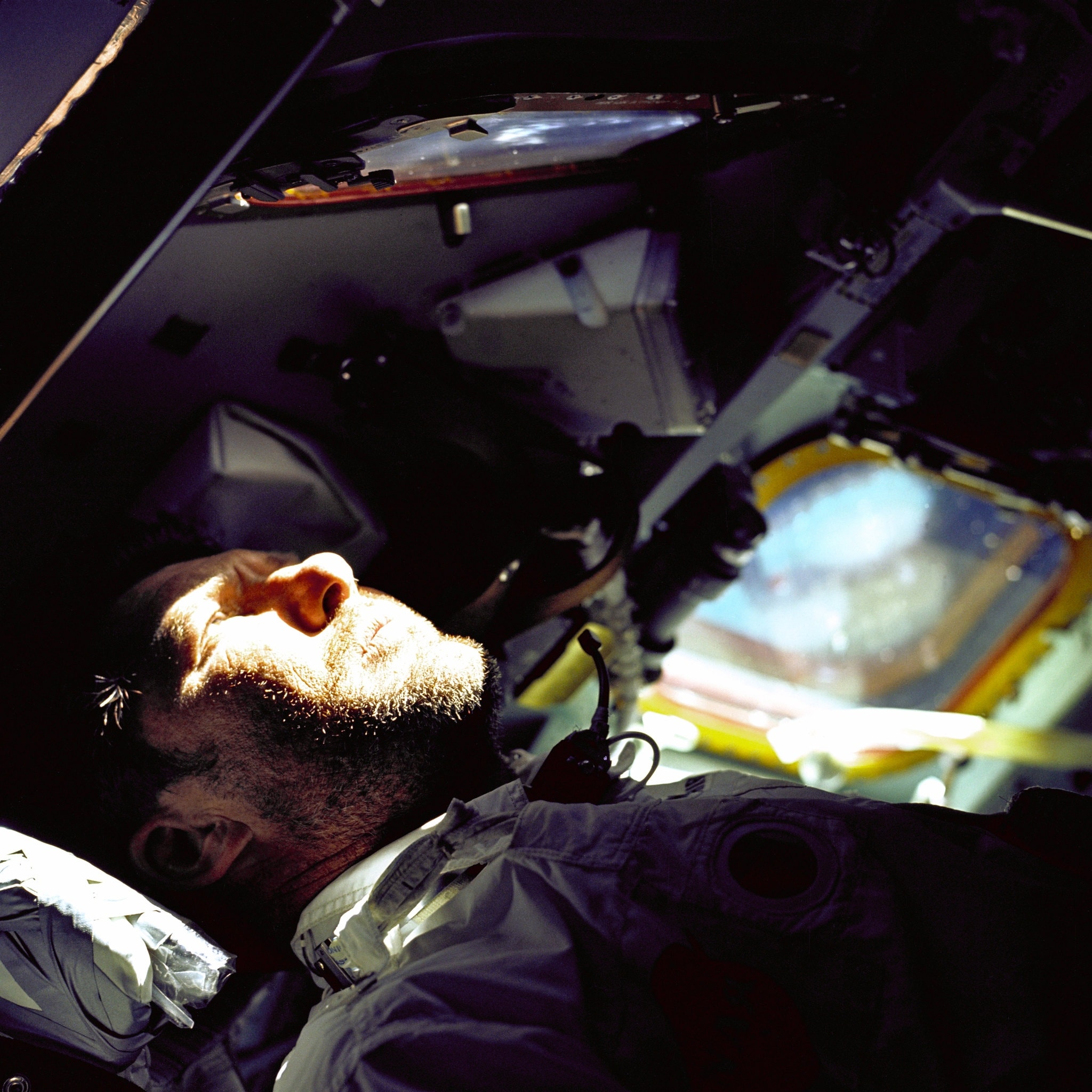 Space - Bathed in sharp sunlight filtering through the spacecraft ...