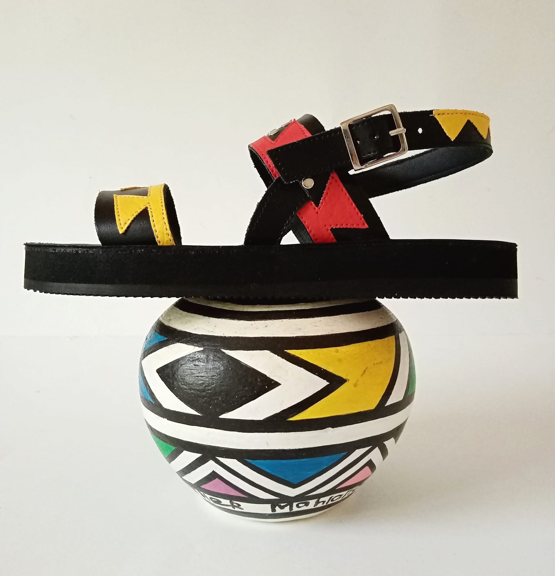 IFELE - MASKANDI sandal with Esther Mahlangu pot. African... | Facebook