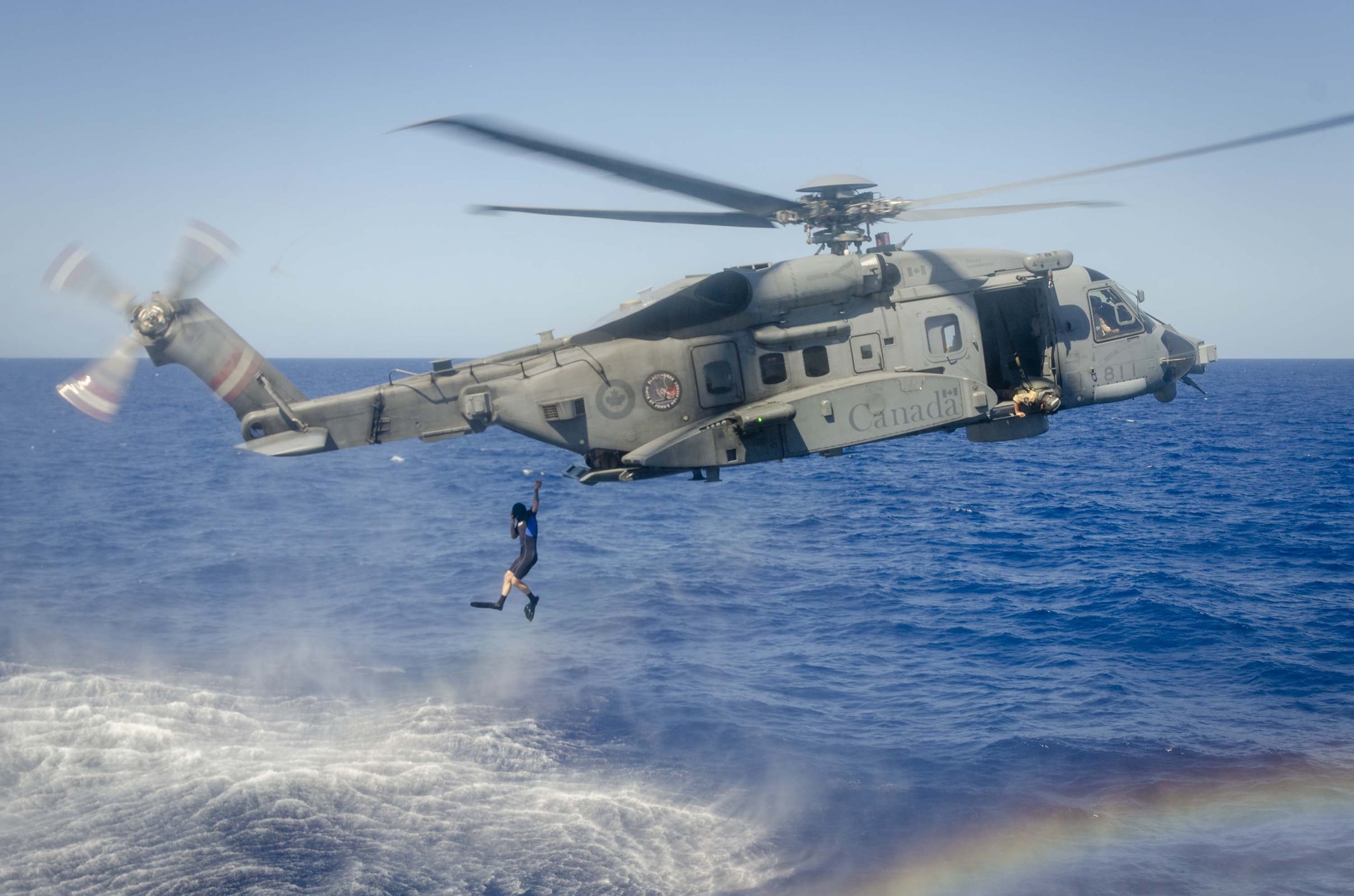 Royal - Divers of HMCS St. John's jumping out of BLACKHORSE a CH-148 ...
