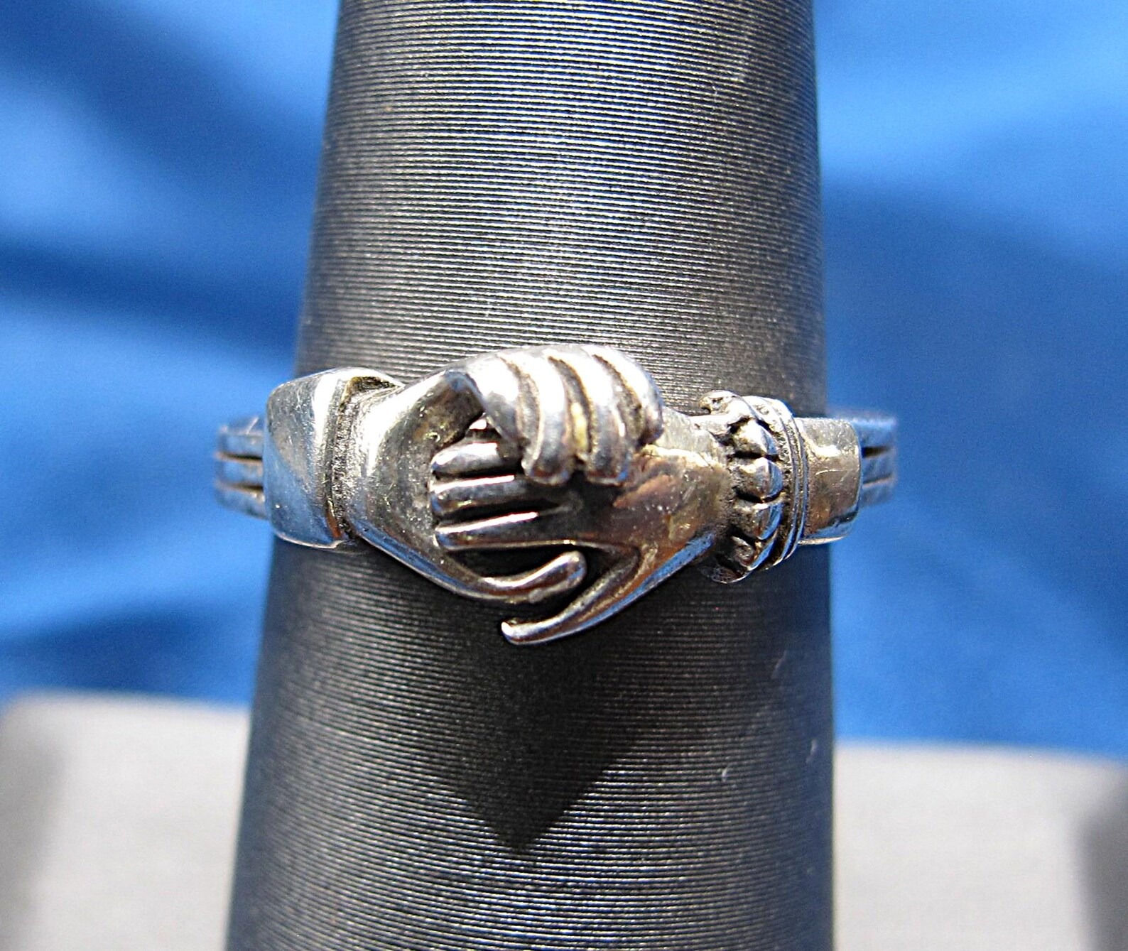 This intriguing fede gimmel ring shows two hands being joined ? A 