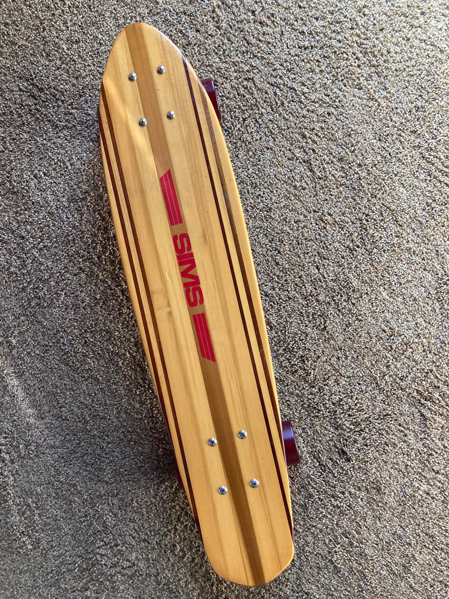 Nos Sims Taperkick skateboard with Pure Juice wheels and Megatron