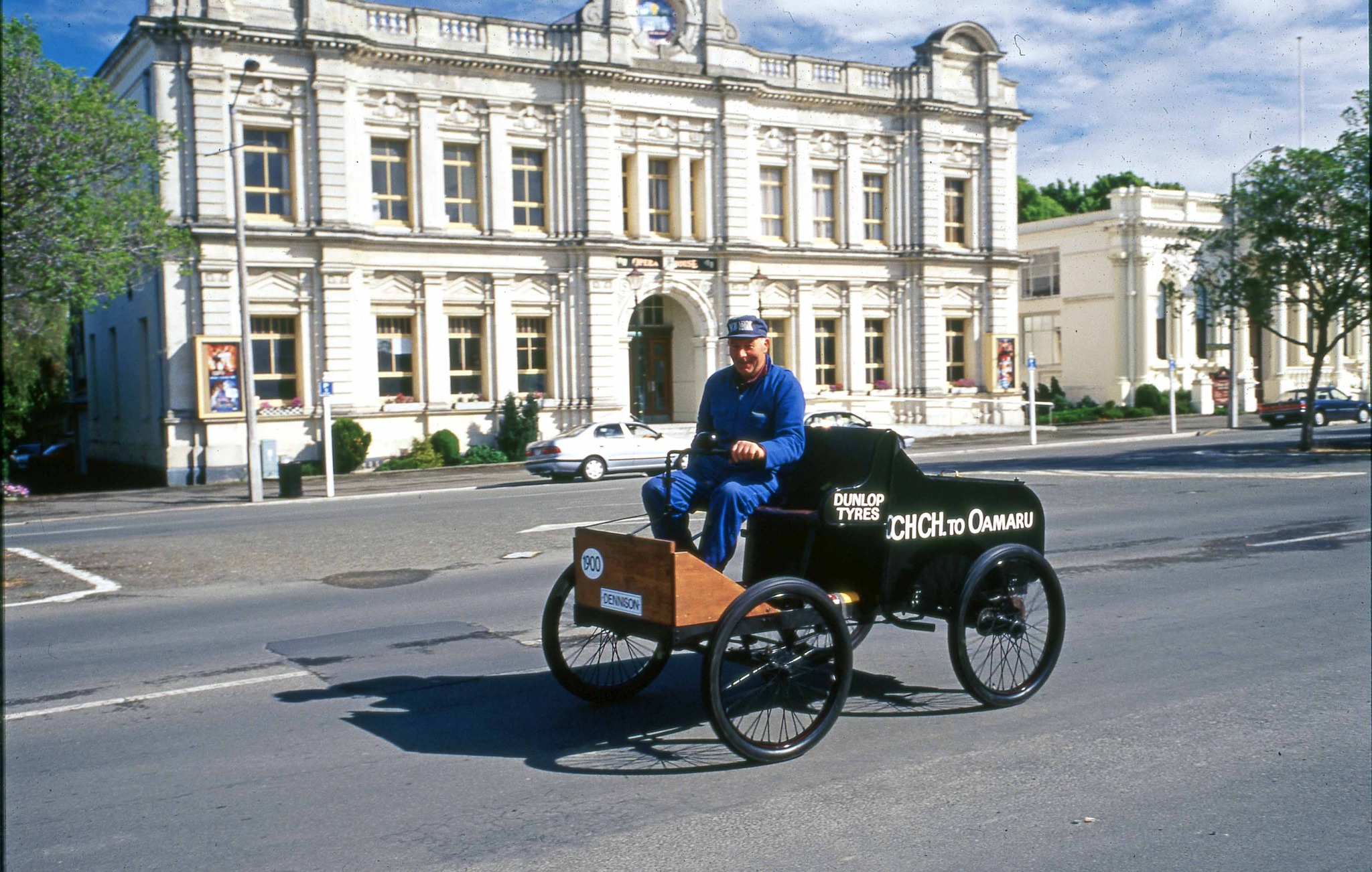 Waitaki - An unidentified man driving a replica of the first motor car ...