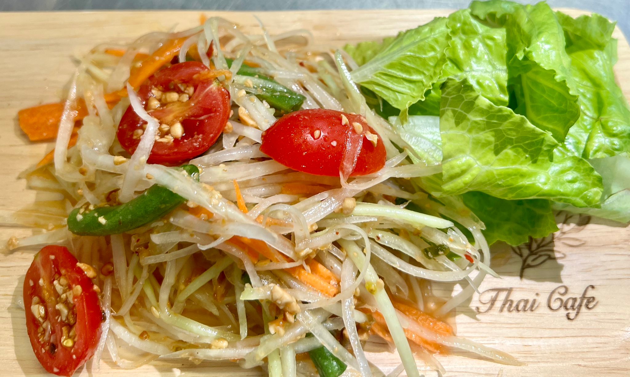 Thai - Green Papaya Salad Mixed shredded green papaya with tomatoes ...