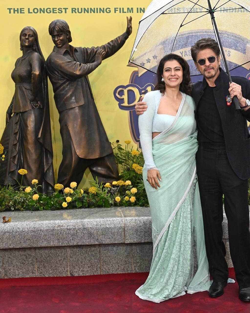 kajol green dress In celebration of 30 years of Dilwale Dulhaniya Le Jayenge in Leicester Square, #Kajol (@kajol) wears a soft pastel pashmina #MMsaree, edged with pearls and French lace, and paired with a contemporary kajol ddlj outfits
