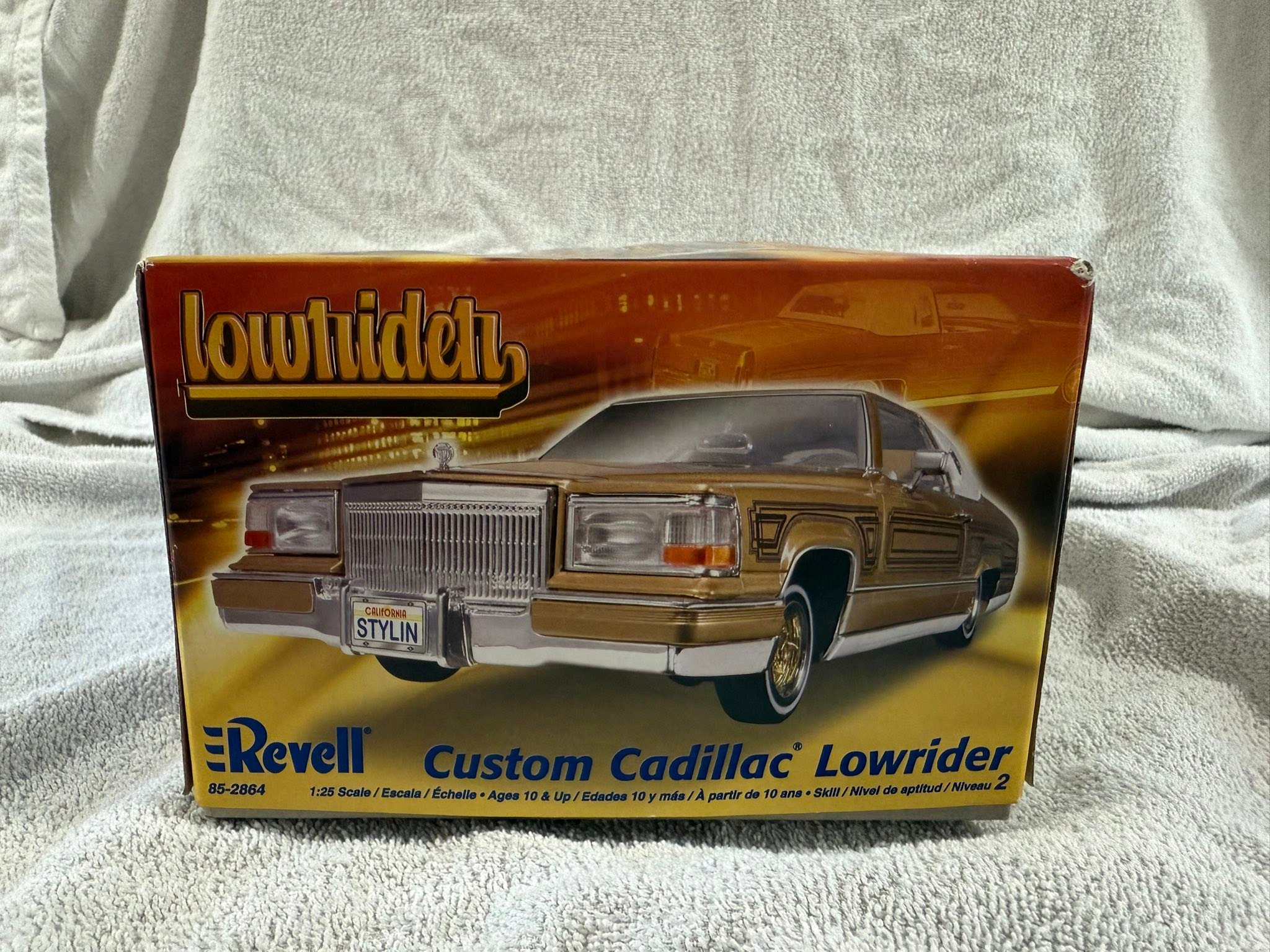 Roll in style with the Custom Cadillac Lowrider. This model kit