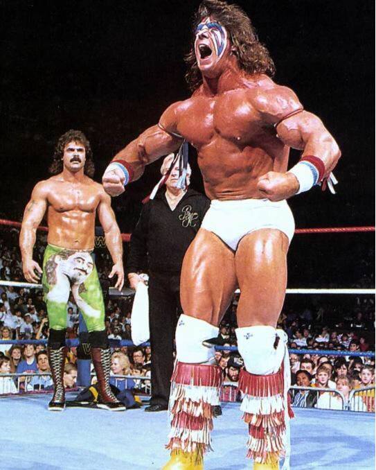 Retro - Ravishing Rick Rude looking at Ultimate Warrior like 