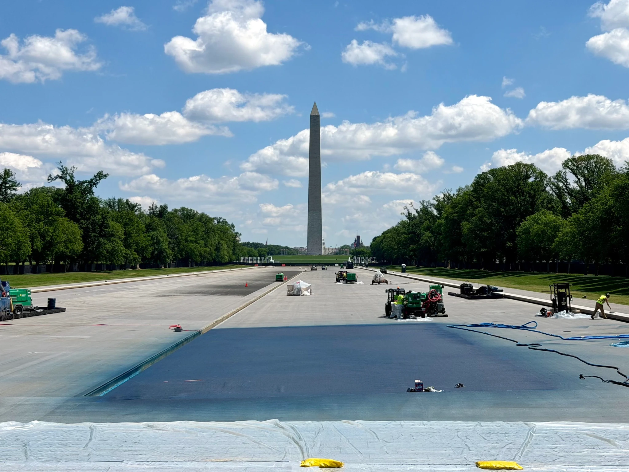 The Reflecting Pool is being painted “American Flag Blue,” but