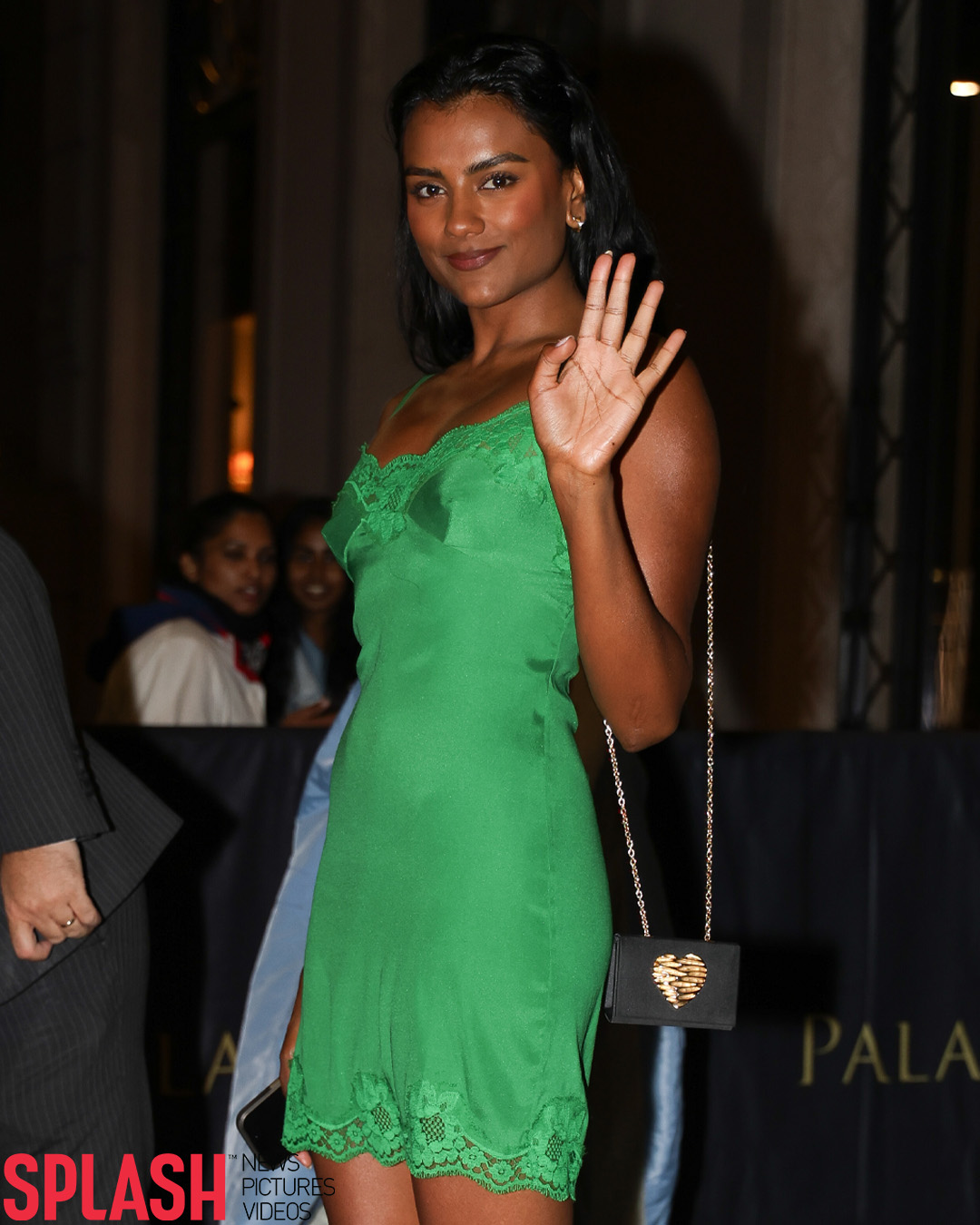 simone ashley green dress turned heads wearing a striking mini dress, paired with elegant Prada heels and a chic Dolce & Gabbana bag, while in Milan for Fashion Week 💚 📸 Aissaoui Nacer # Magda Butrym